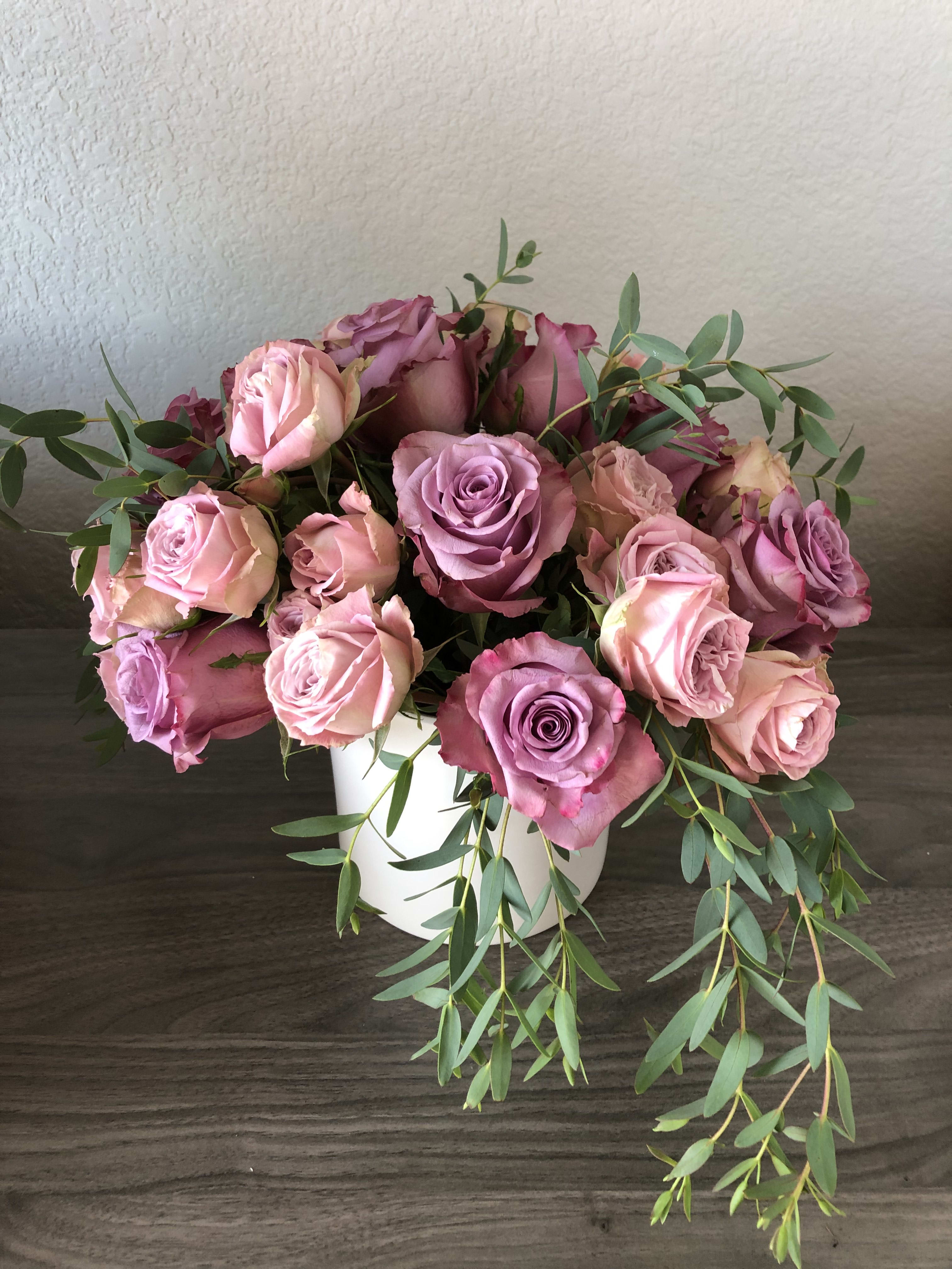 Beautiful Pink Roses.  - Different shades of pink in a beautiful white cylinder. 