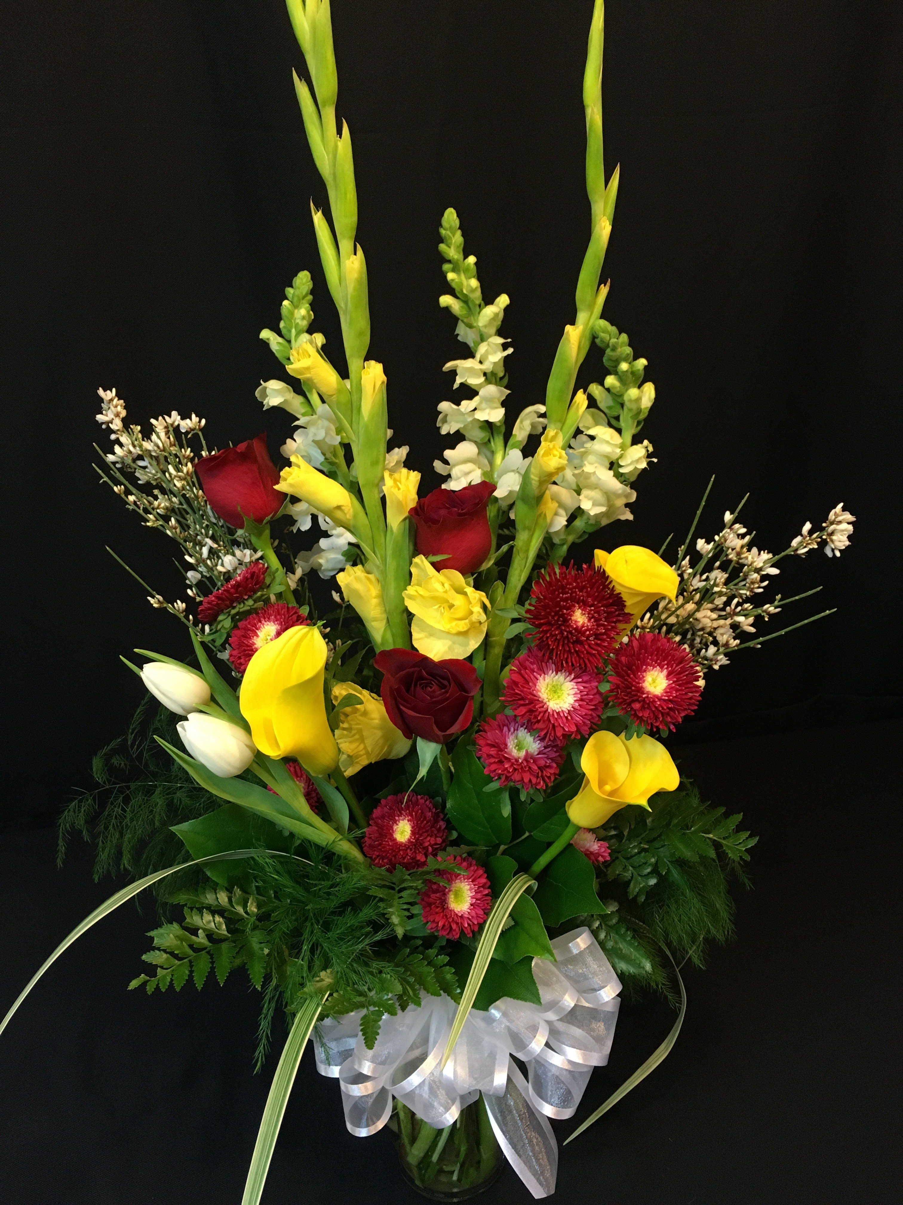 Mixed Bouquet with 3 Roses - Designer's Choice of flower selection. Includes 3 Roses! We will choose fresh seasonal flowers for you with a valentine theme. We offer this bouquet at a low price because we can quickly execute it by choosing what we have on hand and what we think looks best at the moment. NO Customization available on this item. This bouquet may not resemble the photo but will be to full dollar value and will be FRESH and gorgeous! Shown are 2 past examples to give you an example of what's in store!