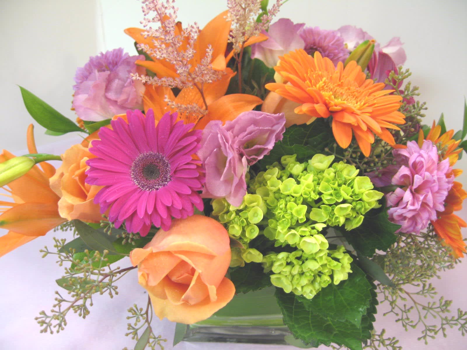 Fall Garden  (Picture is Deluxe) - Fall Colors Gerbera Daisies, Roses, Green Hydrangea,, Assorted Fancy Greens