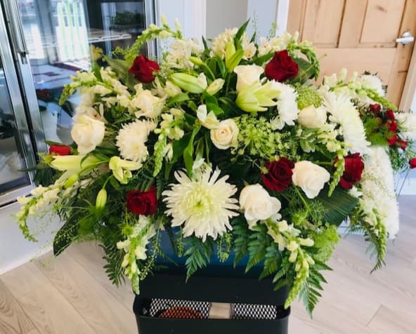 Casket Spray - Pictures are examples only. Prices are our starting price and may not reflect the pricing of sample pictures. Please call or visit us to place an order.