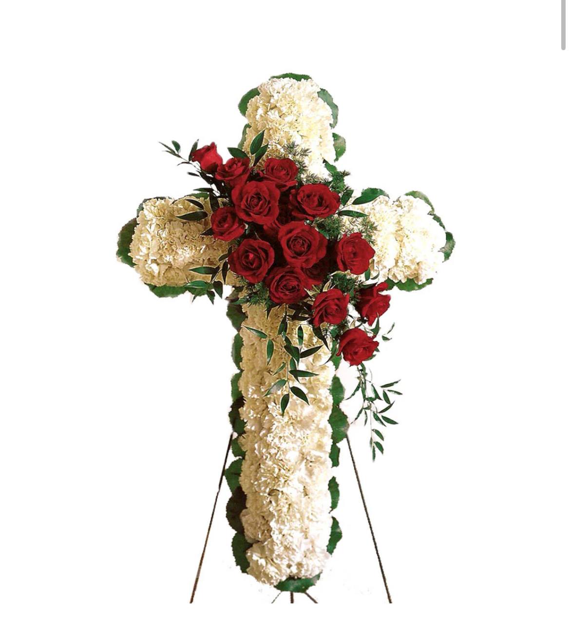 Cross With Rose Break - Simple and elegant describes this thoughtful floral cross of white carnations with a red rose break. Appropriate to send to the funeral home. Arrangement is delivered with an easel for display.  