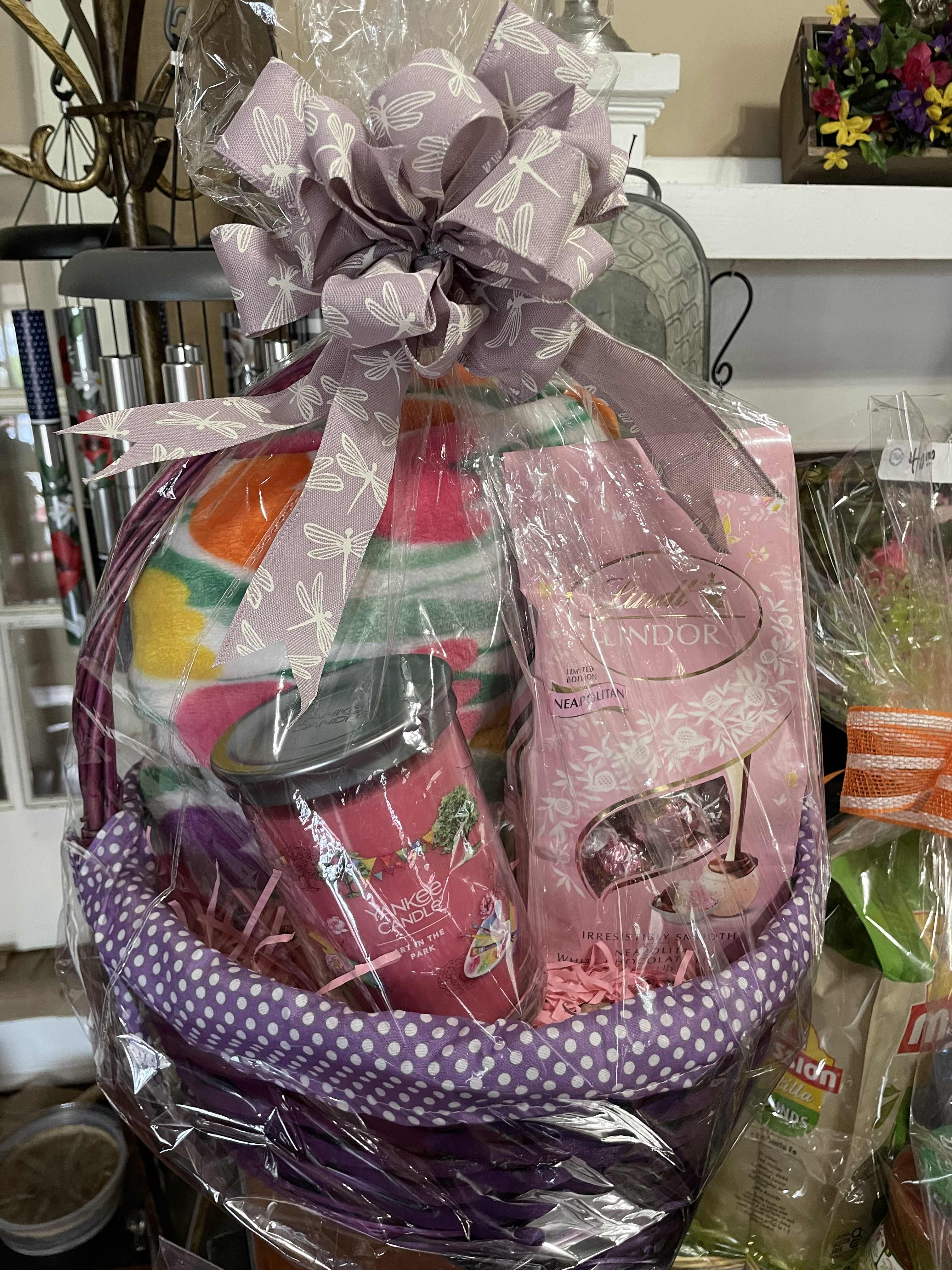 Happy Tulip Happy GiftBasket - A Large Soft and cozy throw, so sweet covered in tulip pattern. Wrapped up for the home in a purple basket with a bag of Truffles , yankee candle.