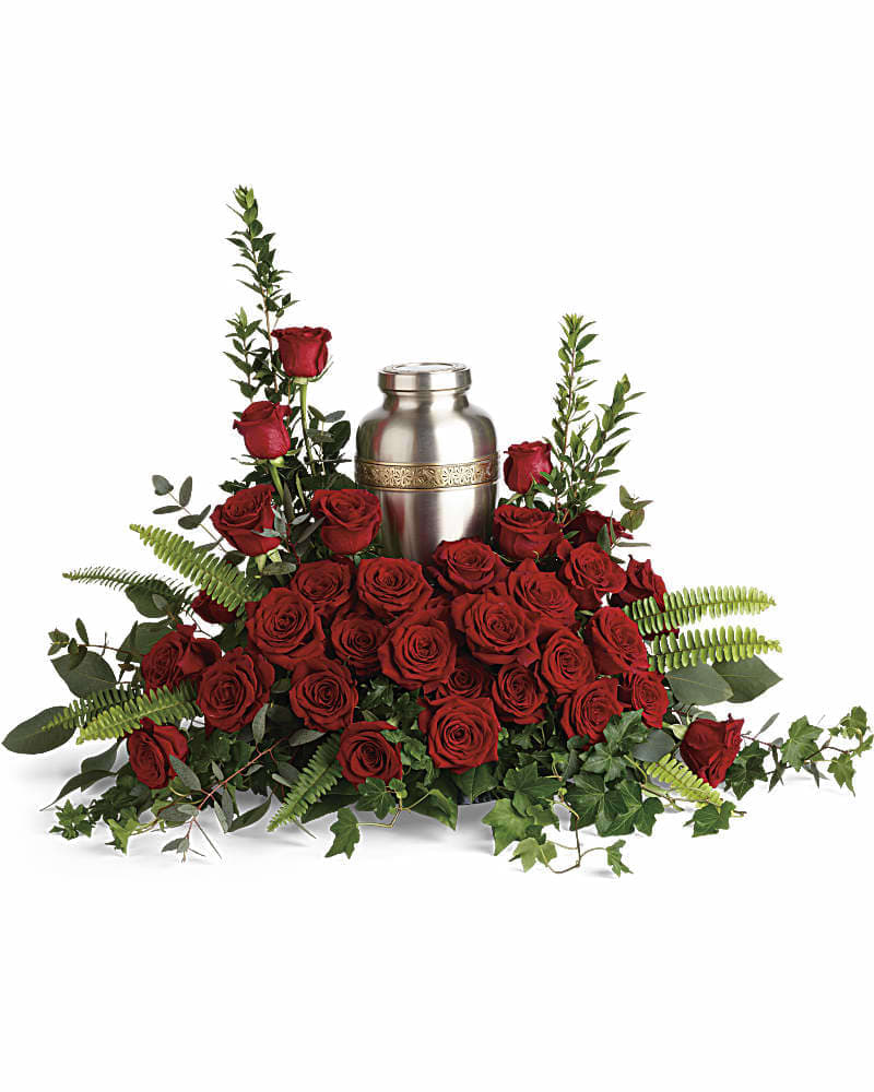 Forever In Our Hearts Cremation Tribute - Elegant red roses and delicate greenery are a breathtaking way to display and honor the cremation urn. Red roses are arranged with myrtle green ivy sword fern silver dollar eucalyptus and lemon leaf. Arrangement does not include urn.