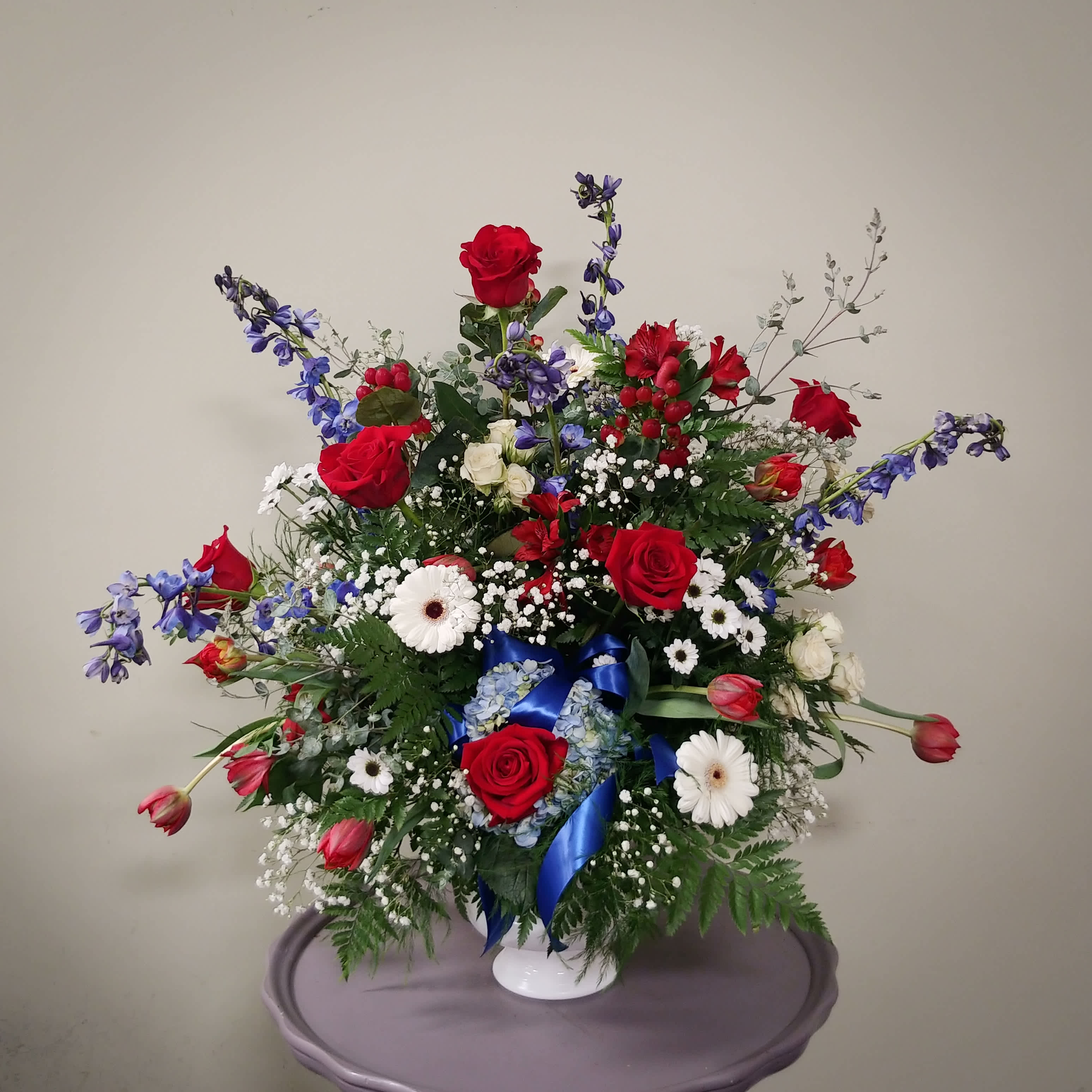 Red, White, and Blue Sympathy Basket  - This Patriotic Floor Basket is the perfect expression of honor during these difficult times. Often sent by fire departments, EMS, police agencies and other group that devote their lives to serving others.