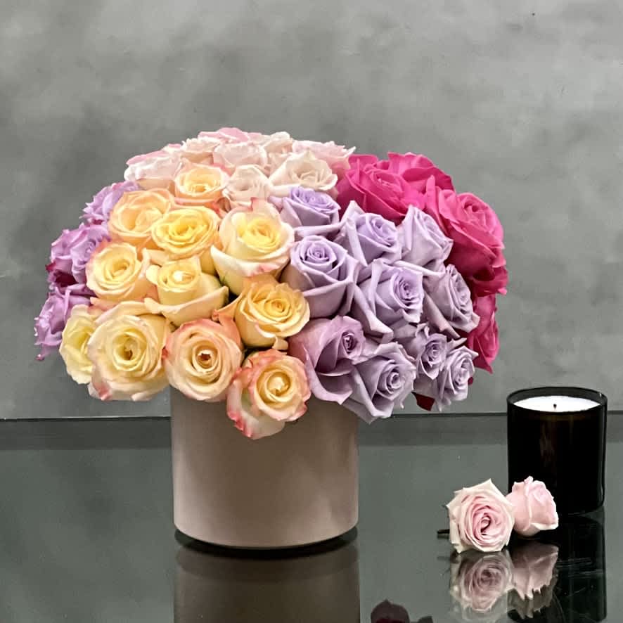 The Joy of Roses - Vibrant and beautiful.... this arrangement is artfully created multi-colored Roses combining brights and a sprinkling of pastels matted yellow vase created by Beverly Hills Florist.  The stunning color combination radiates joy and happiness and will deliver the same to the receiver. Great for Birthday, Thank you, just because, love and romance, and congrats.   Aprox.: 14&quot; round and 14&quot; Tall in a 6&quot; Ceramic vase 