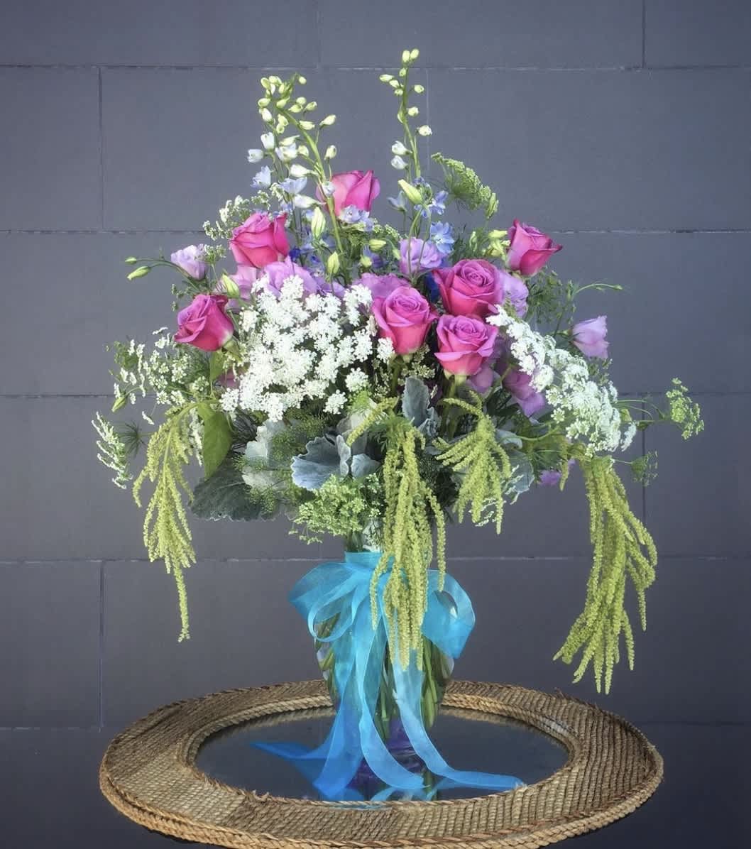 Harmony in Bloom - Beautiful vase arrangement featuring pink roses, blue amaryllis, lavendar lithianthus, green amaranth, and other green accents.