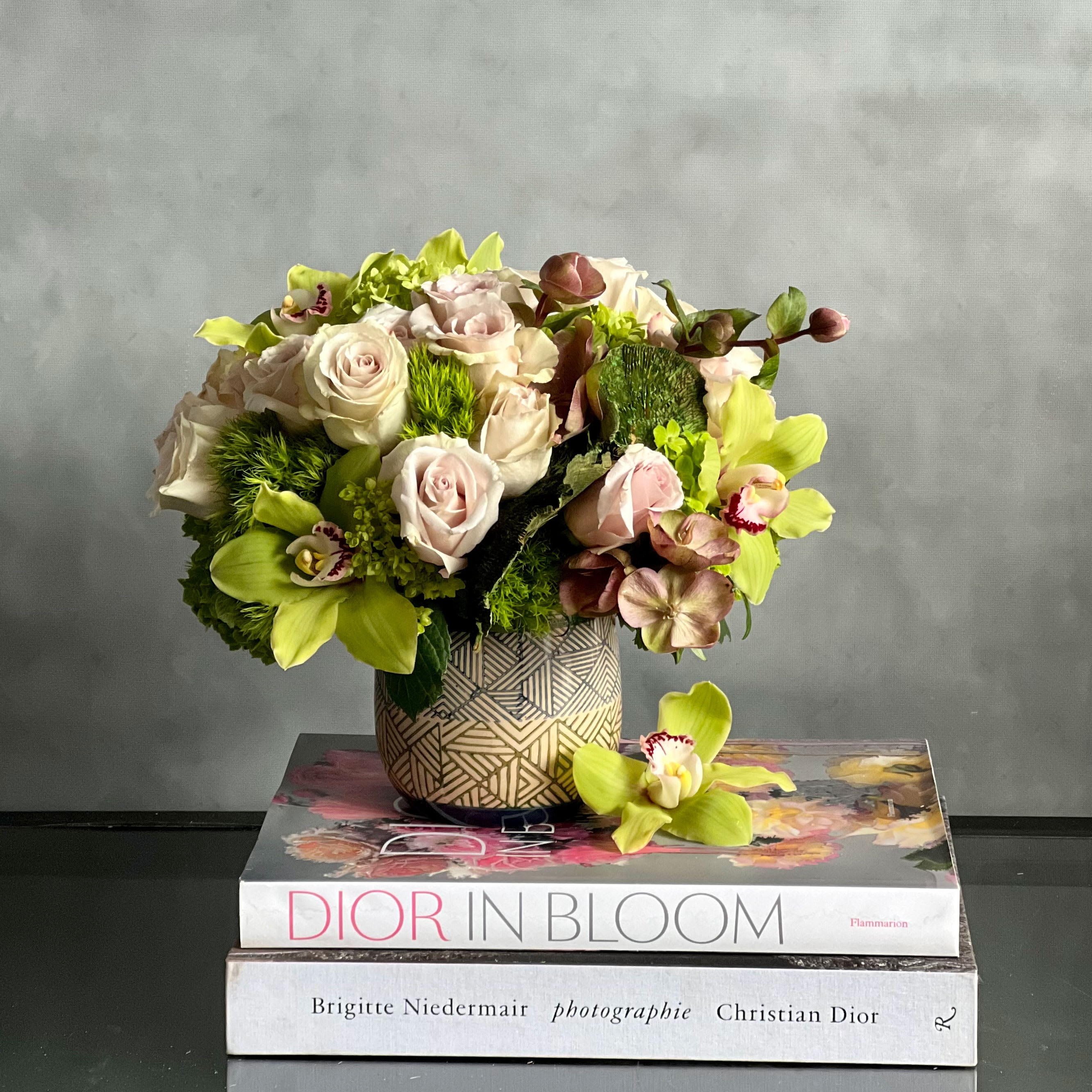 A Rustic Romance  - A modern take on earthy toned florals! Our &quot;Rustic Romance&quot; is a beautiful way to say I Love You, Thinking Of You, Just Because and Thank you. Beautifully arranged with seasonal greens, Green Cymbidium Orchids, and Roses that are arranged within an earth toned geometric ceramic vase. 