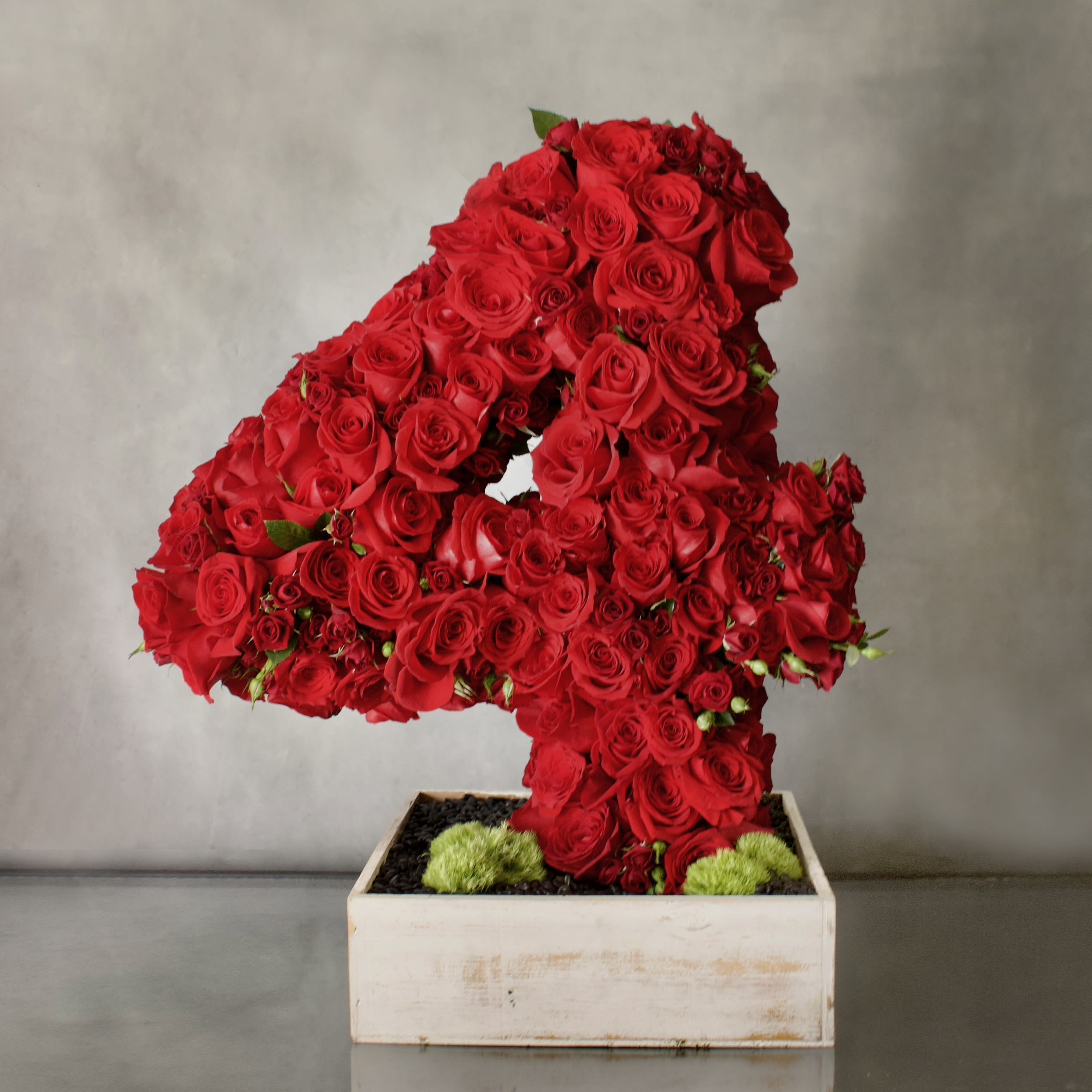 Numbers of Love  - A beautiful number covered in various types of Red Roses, about 200 blooms. Accented with black rocks at the bottom of the white washed box and some moss to add a pop of color. 