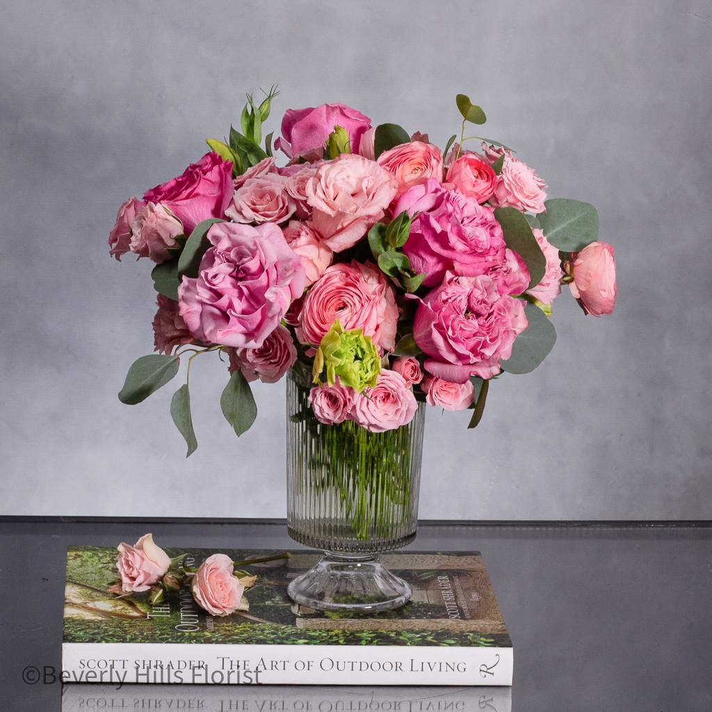 A Case of Hot Fever - Introducing our charming floral arrangement, meticulously designed for same-day delivery. Nestled in a tall vase, this arrangement features a delightful combination of garden roses and ranunculus, arranged in a circular formation measuring 10 inches in diameter.  Each bloom is carefully selected for its freshness and beauty, ensuring a captivating display that will brighten any space. With the soft, romantic allure of garden roses and the delicate charm of ranunculus, this arrangement exudes elegance and sophistication.  Whether you're celebrating a special occasion or simply want to surprise someone with a thoughtful gesture, our garden roses and ranunculus arrangement is the perfect choice. Order now and let us deliver a touch of beauty and joy to your doorstep, with same-day delivery available for your convenience.