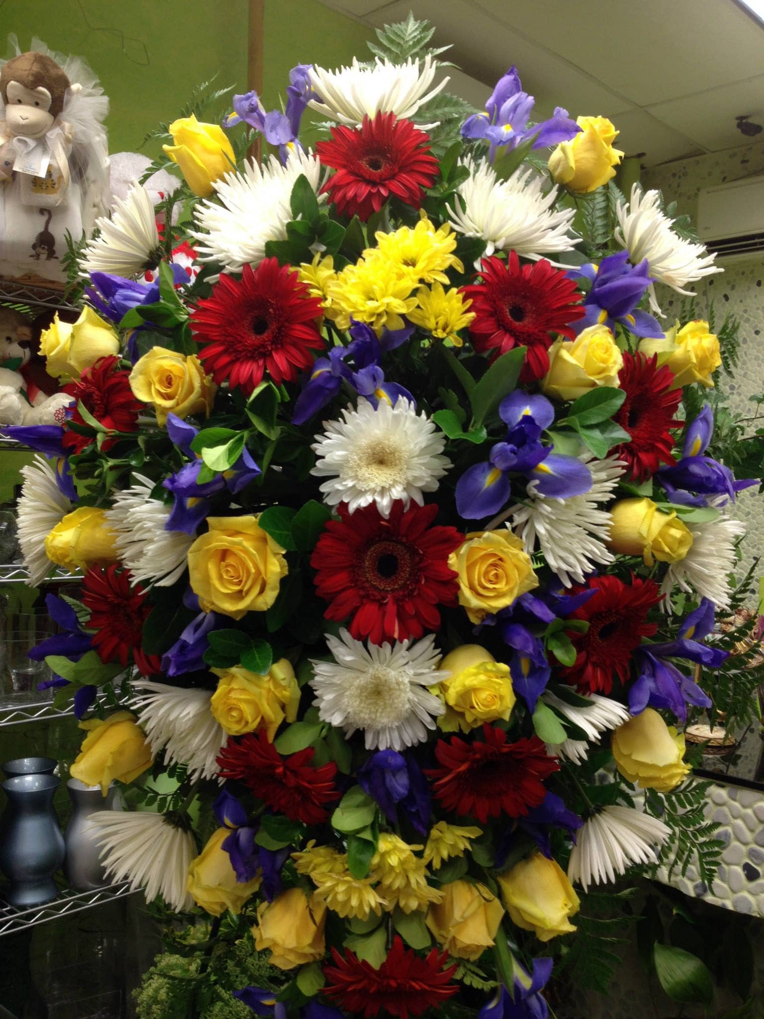 Standing Casket Spray 1 Br. The Photo Shows A Premium Size. - Please call (347) 492 - 5777 for variations and options. Available any size any price any flowers and can be done as a hand rappped bouquet or basket.
