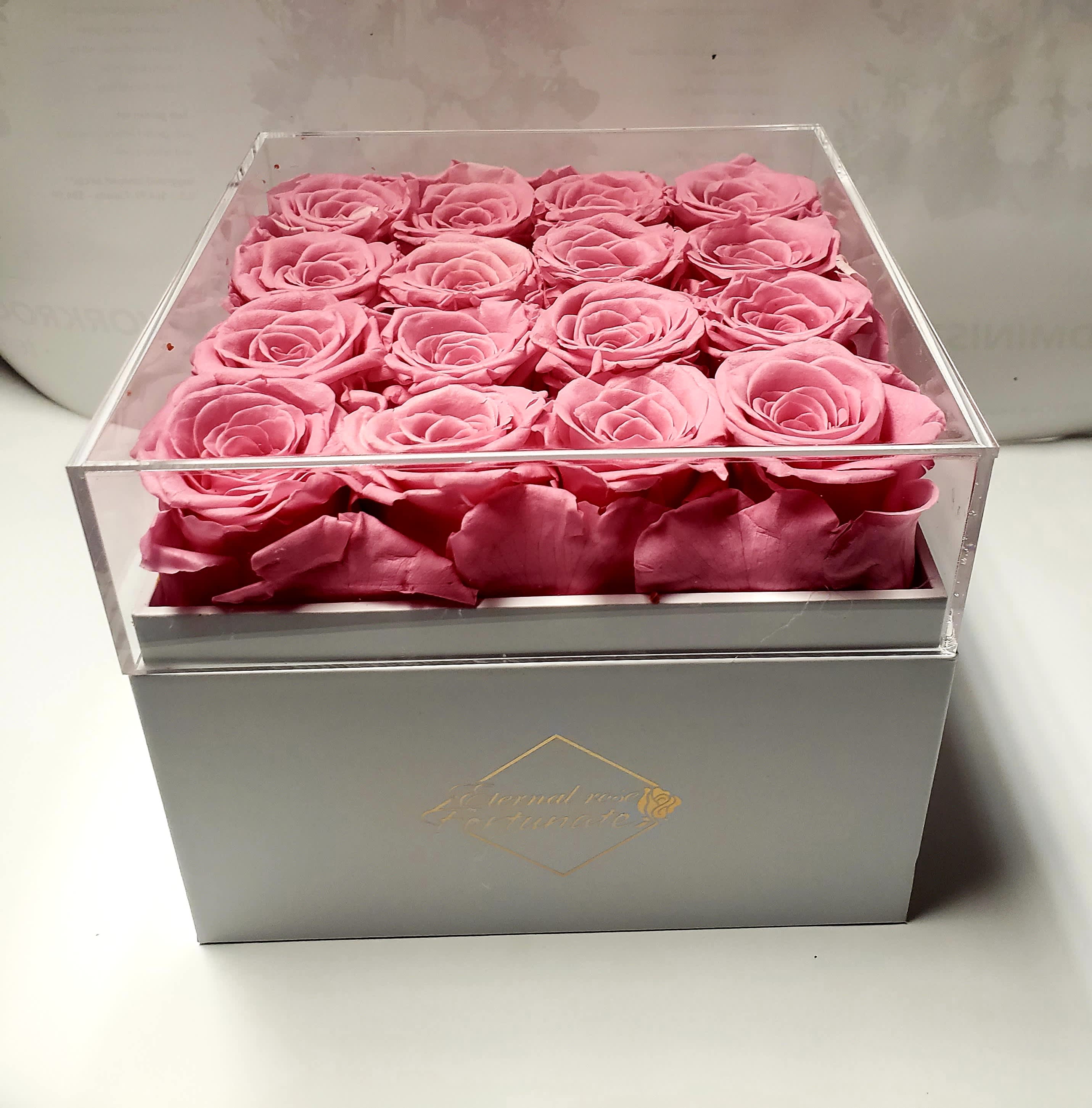 Eternal Preserved Roses Square - 100% Real Rose - Our roses are hand-picked at peak freshness and carefully arranged in a leatherette box. The Box is of high quality. Long lasting Rose - Each rose undergoes an environmentally friendly cutting-edge method which allows them maintain their beauty and color for at least a year. No toxic ingredients, no risk of pollen allergy and no stinky smell. Elegant Display Box: We have specially designed this PU leather round box so you can see the colorful display of stunning rose buds right through transparent film, making them perfect for gift giving. Ultimate Gift for Her – Our Box arrangement serve as a lovely gift that will not only leave a lasting impression, but will also add the perfect dose of elegance and beauty to a room. Maintenance-Free Rose: no watering, no need for sunlight, easy care for years of enjoyment.