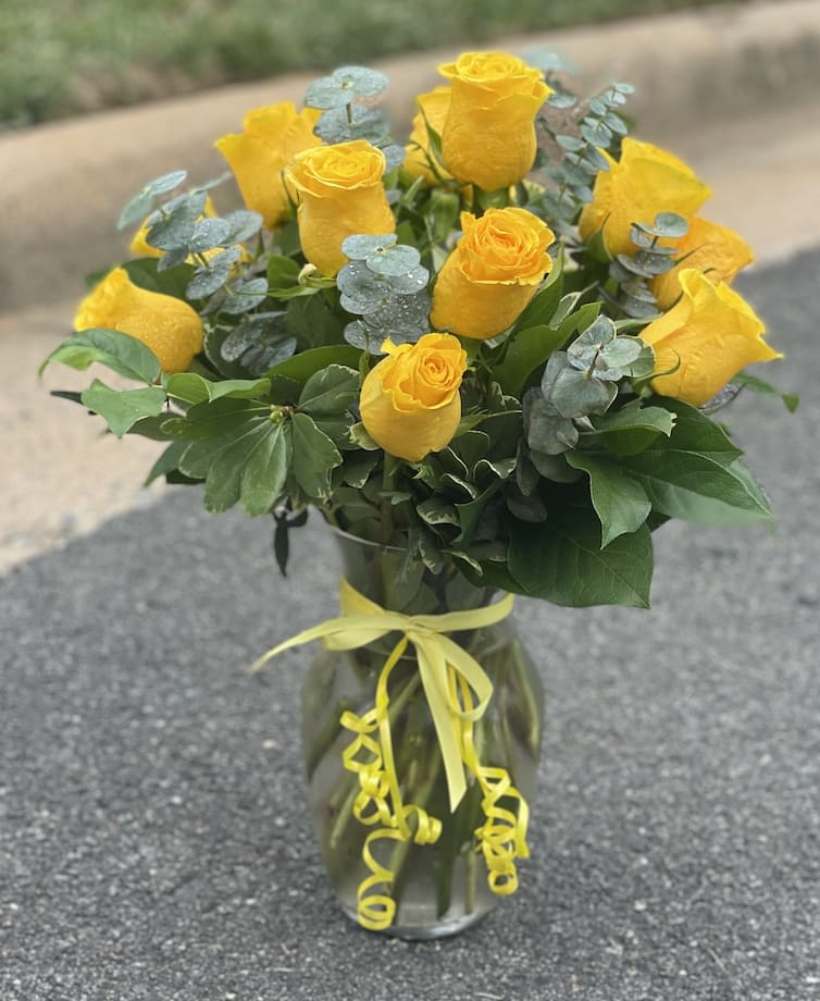 Hello Yellow! Hello Yellow! - Big, bold, sunshiney roses are the surest way to brighten anyone's day. These beauties are delivered with fresh greens in a graceful glass vase.
