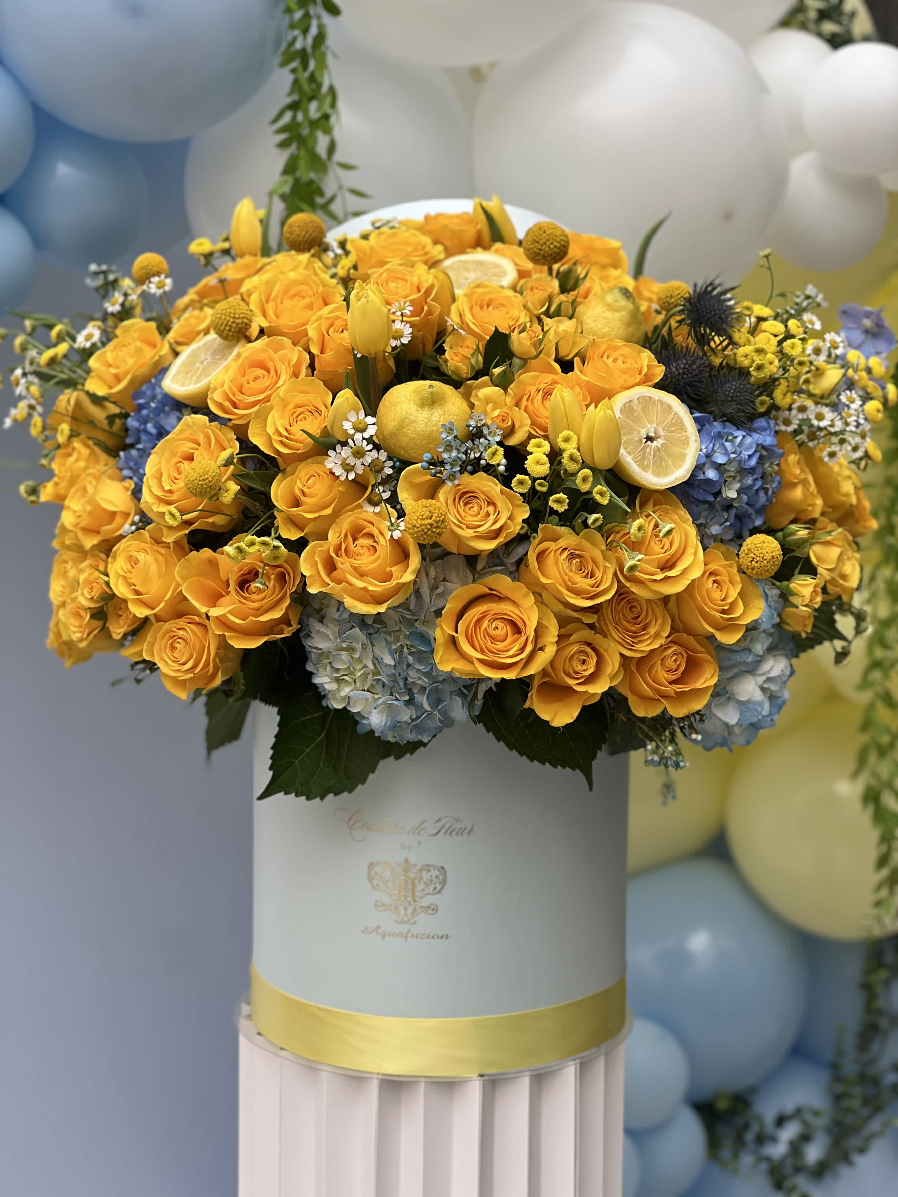 Couture De Fleur Hat Box – Tropical Tango  - Introducing the Tropical Couture De Fleur Hat Box - A sublime choice for baby showers and gender reveals celebrations. This exquisite arrangement is not only visually stunning but can also be customized to your color preference. Contact Aquafuzion for personalization, ensuring your floral vision comes to life with elegance.  