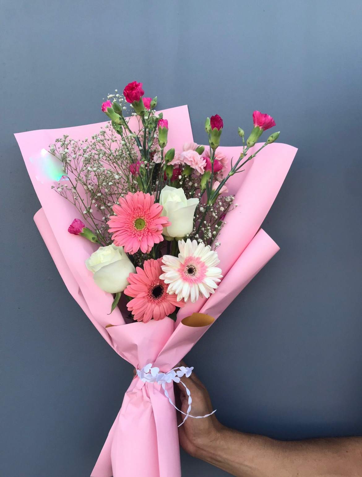 Cutest Pink and White Small Bouquet - Wrapped Bouquet of Gerberas, Roses, and Mini Carnations with Baby Breath Accents. Paper and Flower color may vary depending on availability