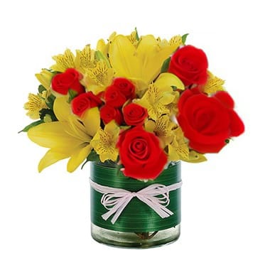 Garden Bouquet Garden Bouquet - A bright combination of yellow Asiatic lilies, red roses and yellow alstroemeria in a cylinder container expertly accented with Ti leaf ribbon. Perfect gift to brighten someone's day