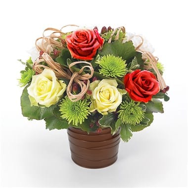 European Garden - Stunning arrangement of roses, poms and hypericum adorned with raffia in a round pot cover. Pot and cover may vary depending on availability. (clear, white, gray, black, brown, ect)