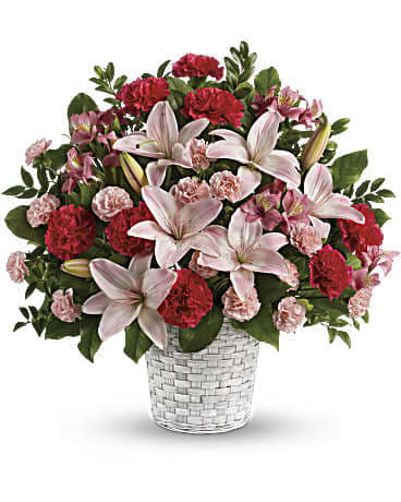 KF_T258-1A Sweet Sincerity KF_T258-1A Sweet Sincerity - Serenely elegant, this radiant bouquet of fragrant pink lilies and other floral favorites is a lovely choice for the service, as well as a thoughtful gift for the home. The stunning bouquet includes pink asiatic lilies, pink alstroemeria, hot pink carnations and pink miniature carnations accented with assorted greenery. Delivered in a white pot basket. Orientation: One-Sided