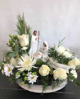 God's Gift God's Gift - Jesus - God's gift to every heart. Manger scene depicting the birth of Jesus surrounded by an array of white flowers and winter greens.