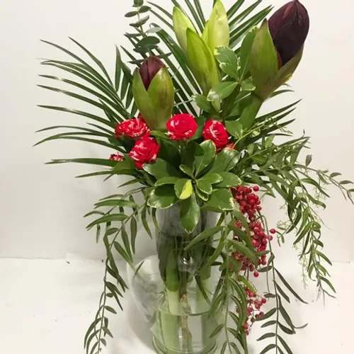 Private Dancer - Loose, modern , high drama arrangement. This arrangement is available as a vase option only. It comes in a tall cylindrical Portugese glass vase. One size $180