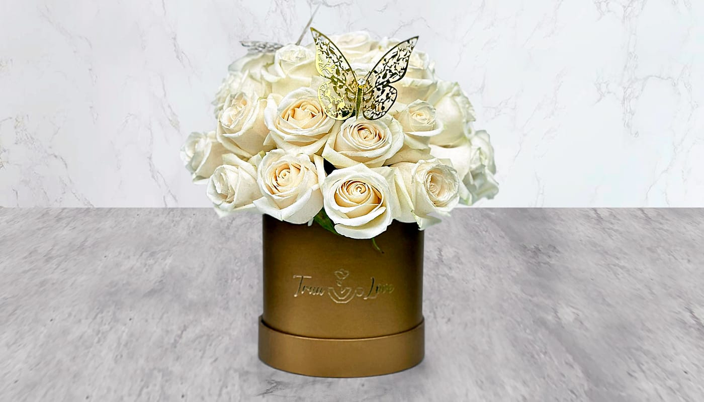 White Rose Gold box  - Elegant, Gold Box This arrangement Contains 35 cream/White Roses and detailed with Butterfly 