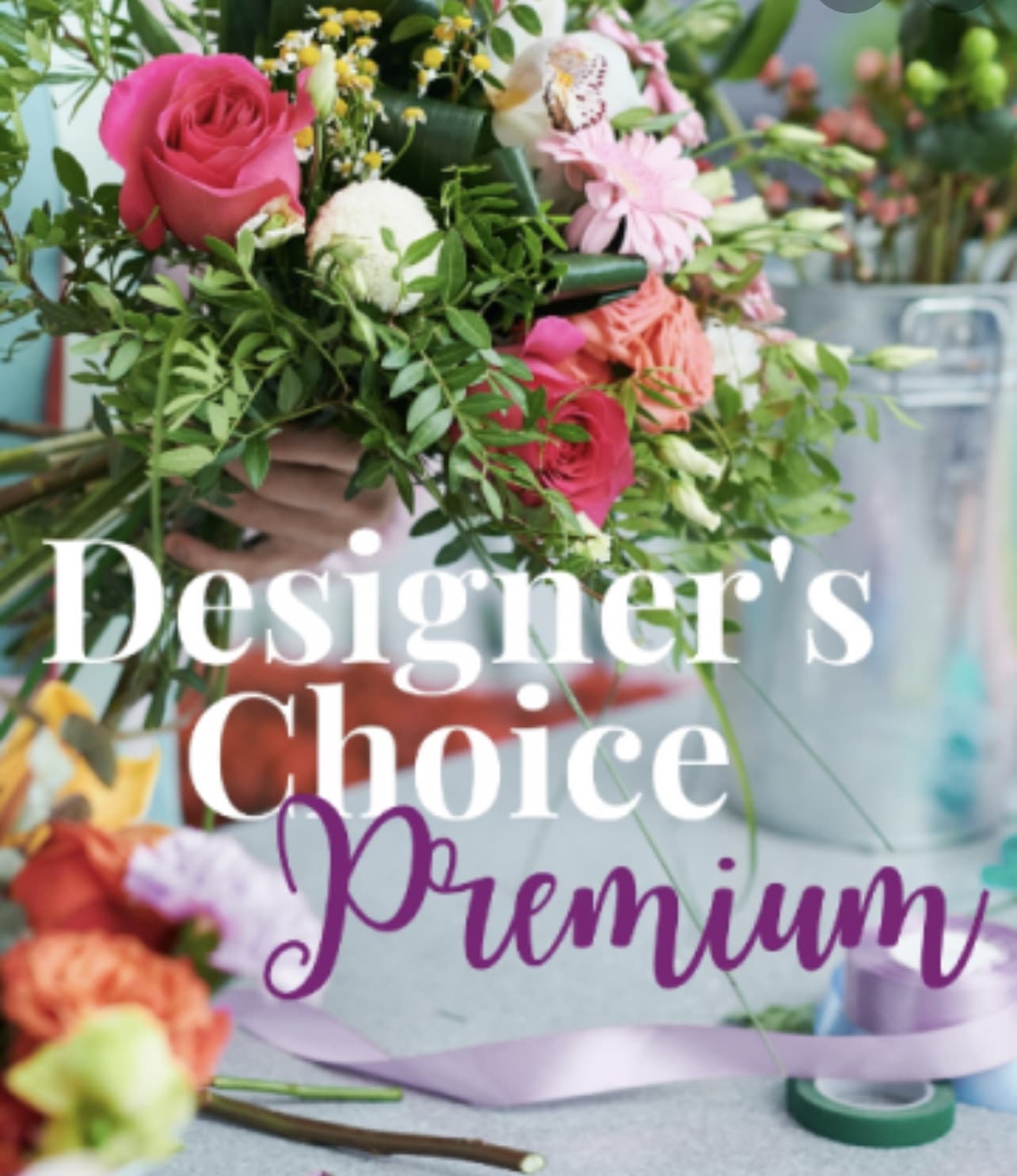 Premium Designers Choice Premium Designers Choice - This is the best of the best available and designed by a master designer. Premium flowers arranged in a clear glass vase.