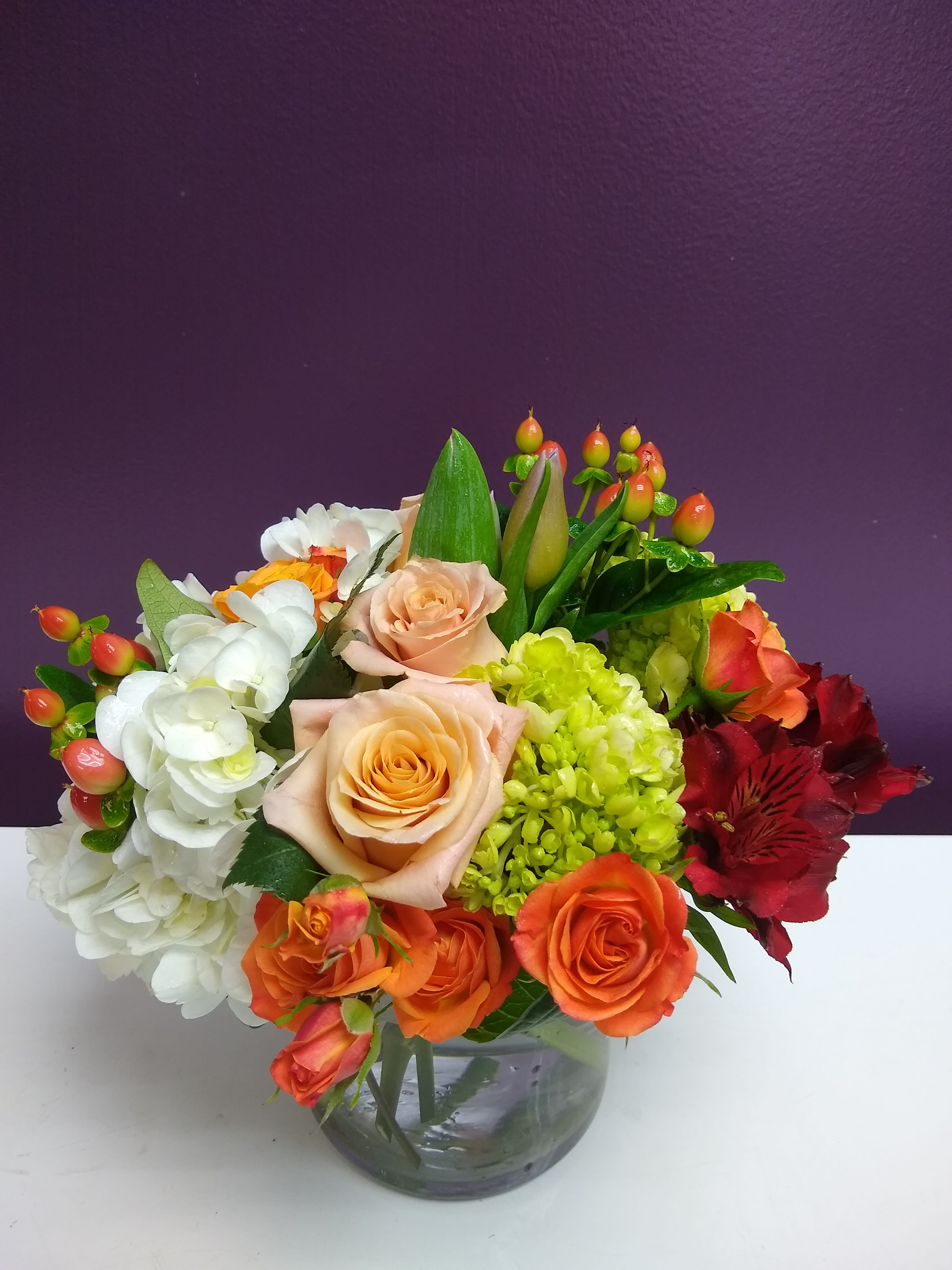 Tangelo Tangelo - Bright and summery, this green, orange, and blush arrangement will add life to any room.