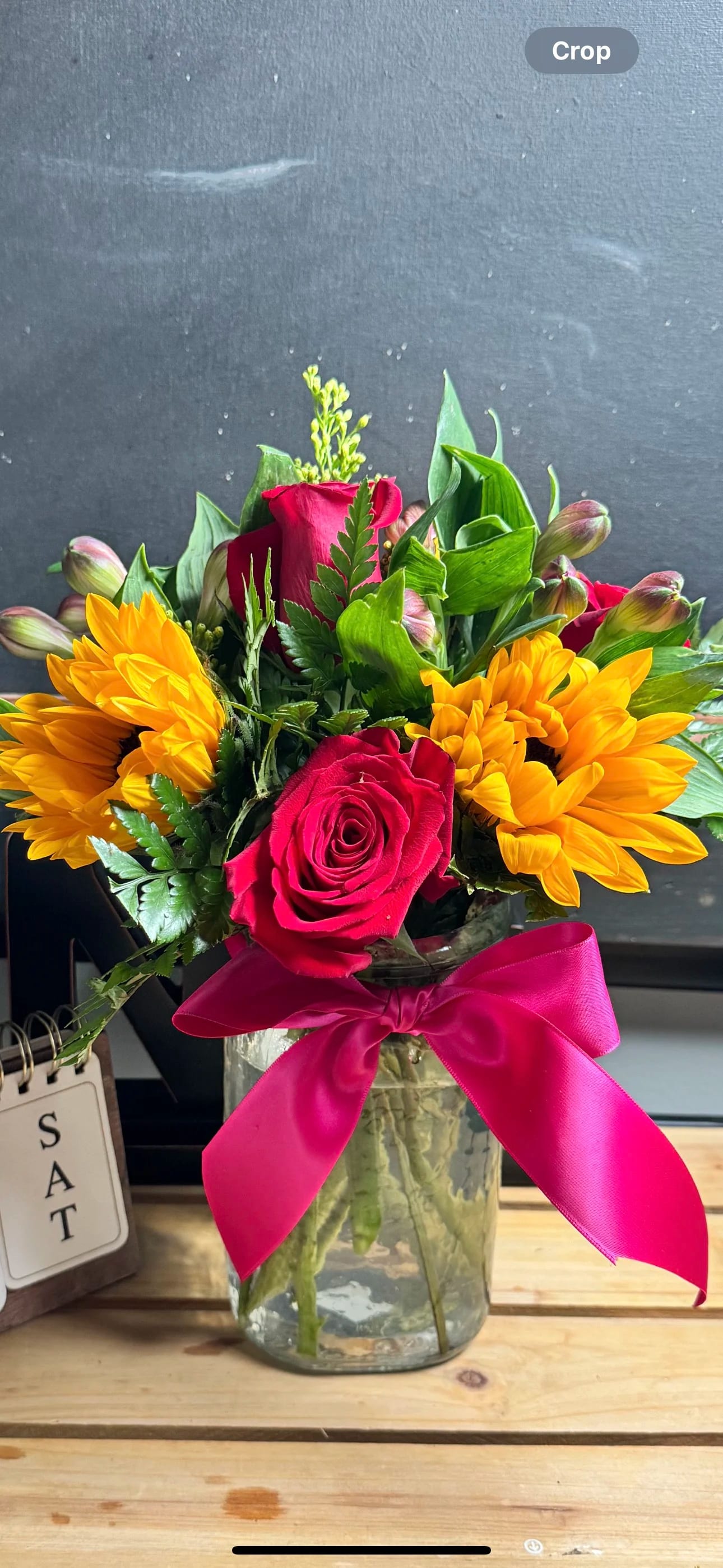 Thinking of You - 3 Roses 3 Sunflowers 1 Solidago 2 alstroemeria Green Foyage Liston Hatpink Measures 12&quot;