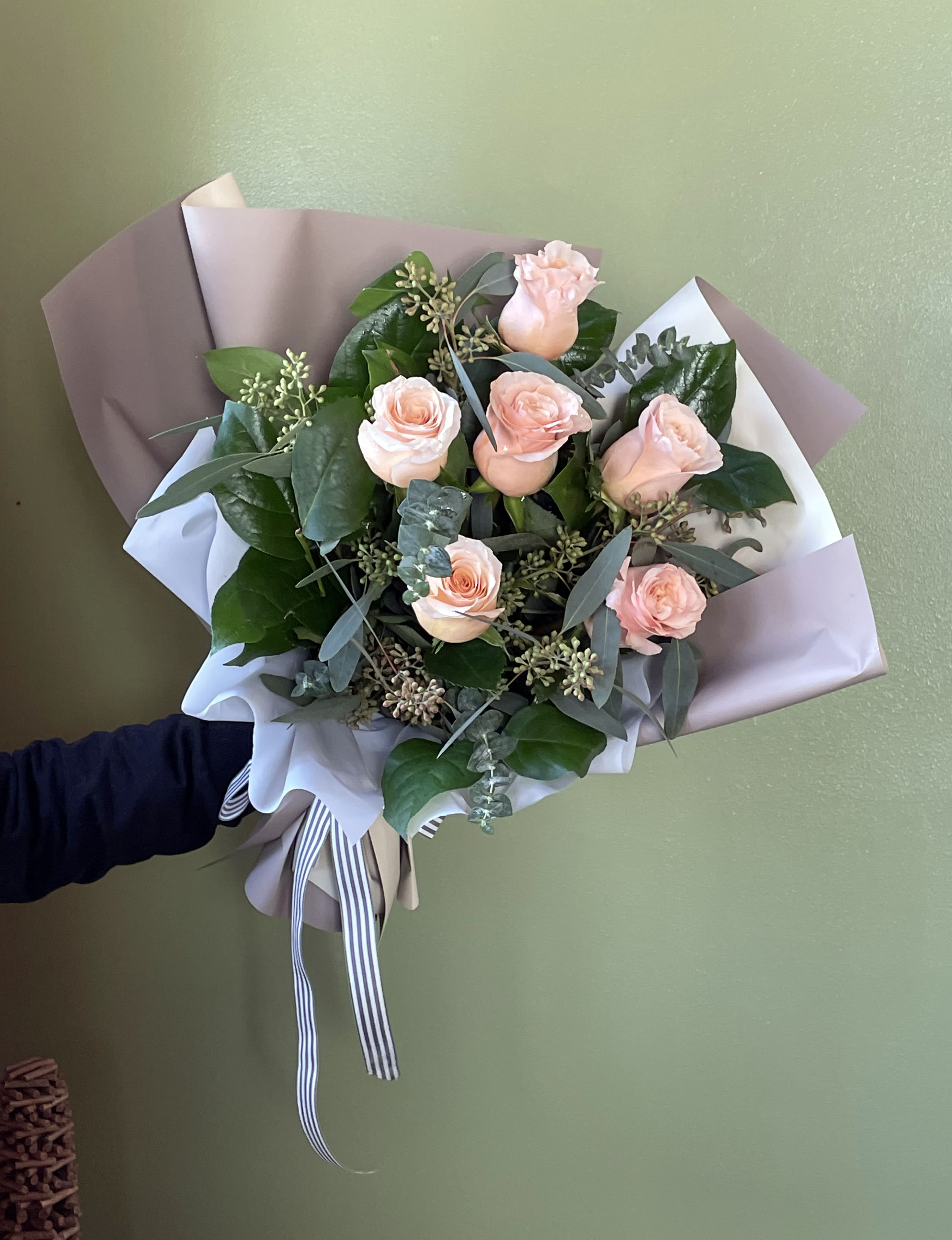 Half Dozen Shimmer Roses  - Introducing our stunning dozen Shimmer Peach Roses, elegantly wrapped in premium paper. Radiating simplicity and sophistication, these carefully selected roses create a timeless bouquet perfect for expressing love, appreciation, or congratulations. The soft peach hues and sweet fragrance make it an ideal gift for any occasion. Elevate your gesture with this captivating arrangement, a symbol of beauty and grace.