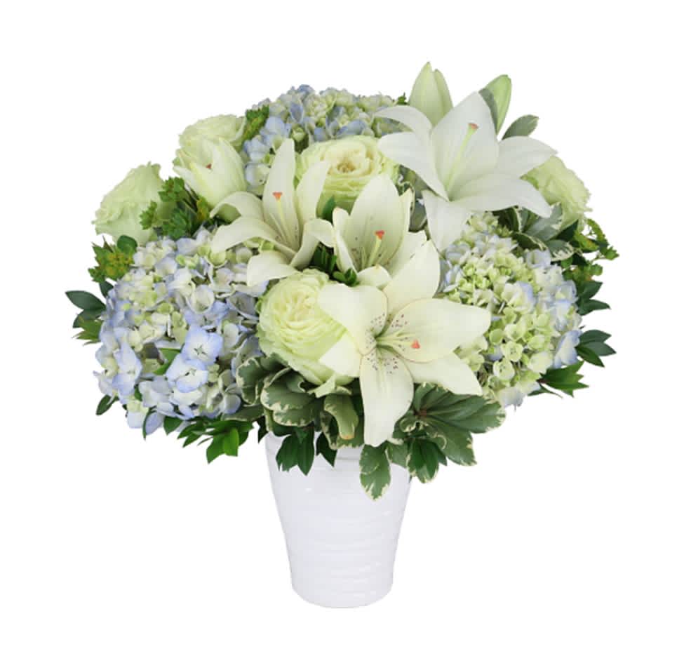 Peaceful Grace - Send an abundance of peaceful grace with this beautifully arranged bouquet adorned with blue hydrangea's, white roses and lilies.