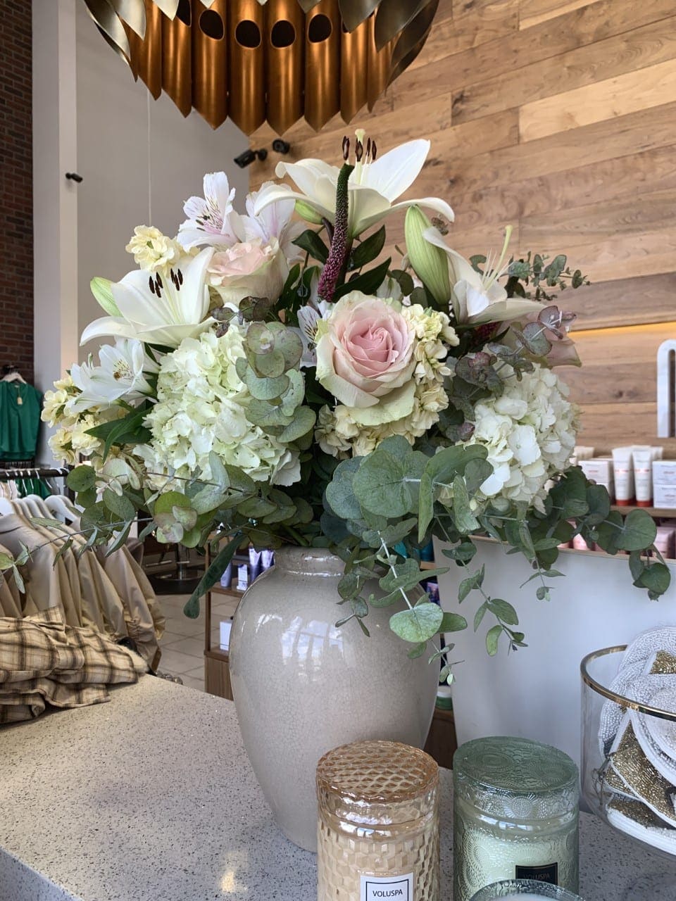 Classy and Chic Classy and Chic - This is a neutral palette of lilies, hydrangea and rose house in a lush bed of greenery, suited for any room or Theme.