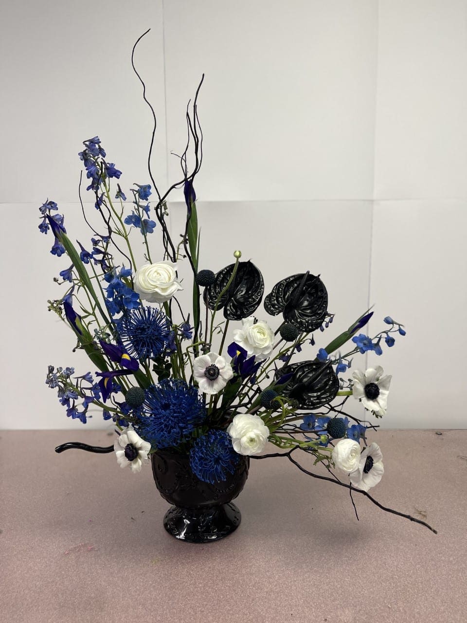 Oceans apart Oceans apart - Pin cushion protea, Anthurium, Anemone are reminiscent of the ocean miles crossed to get beck to you. Flowers convey our love even when we are "Oceans apart."