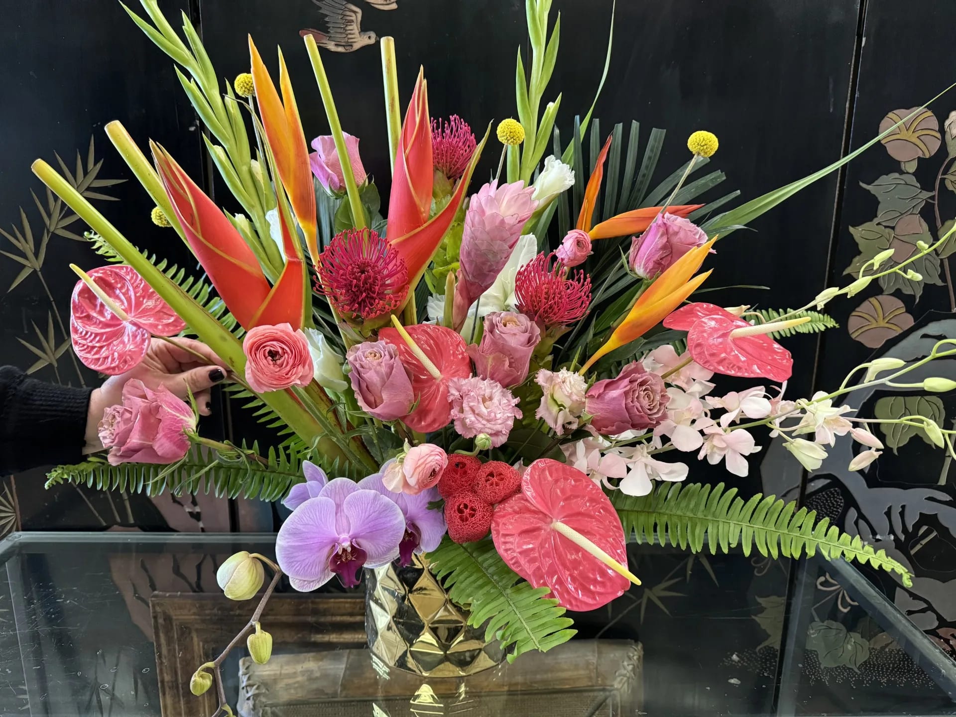 Tropic blast- off Tropic blast- off - An explosion of brightly colored tropical flowers! This is a real show stopper! *flowers are subject to change due to availability