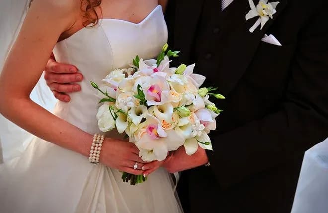 Dedicated Love Dedicated Love - When carrying this bouquet of orchids and calla lilies you will know your dedication to love while walking down the aisle to your one and only.
