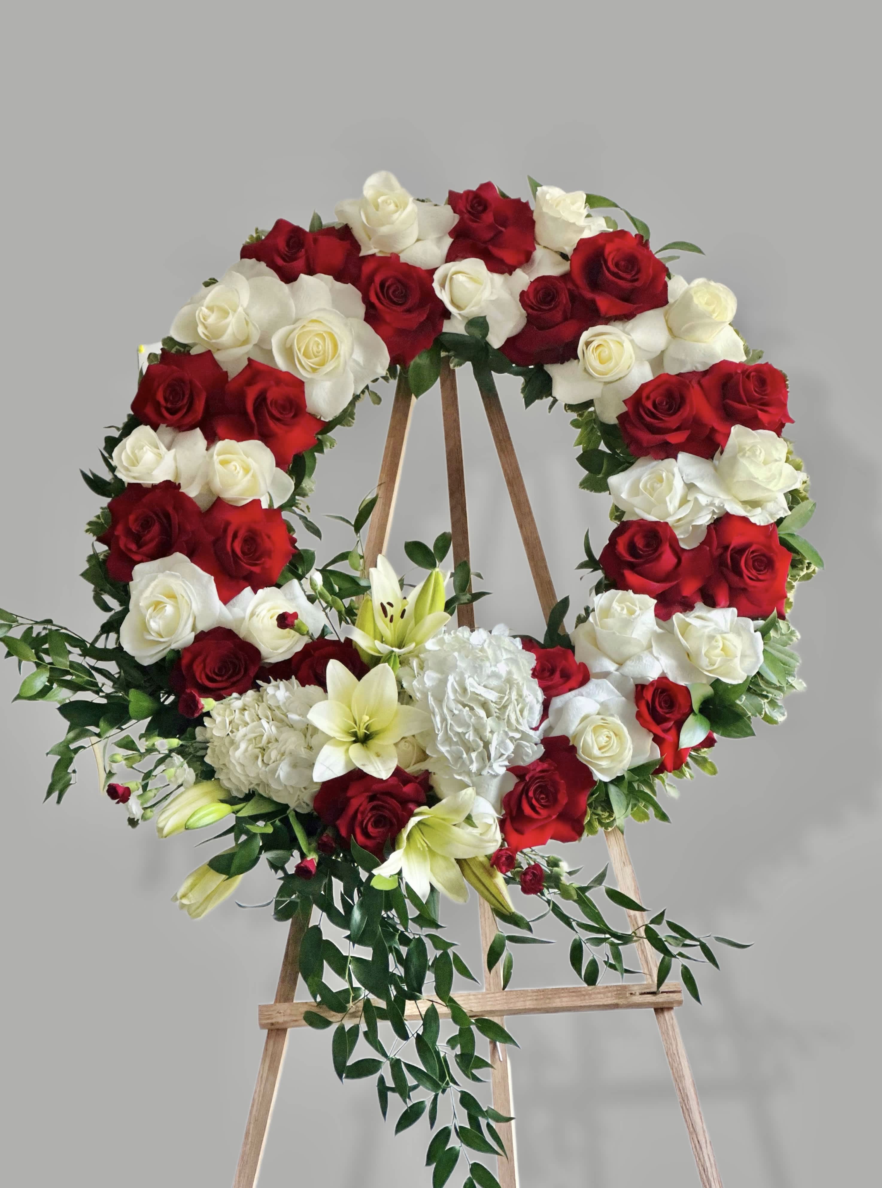 Wreath of white and red roses - Wreath of white and red roses with greenery. 