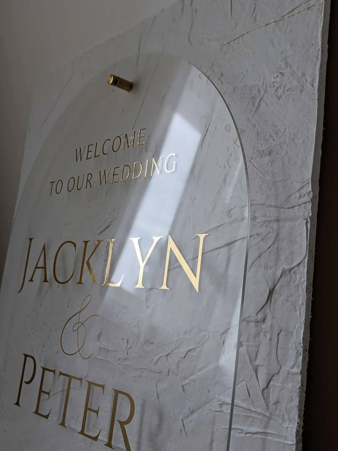  Welcome Sign For Weddingsc - This beautifully textured background adds a unique dimension to an arch-shaped acrylic plate. This sign is currently available in gold vinyl lettering with matching gold bolts.   Customize the colour from our selection or contact us for a custom colour request. The default colour is white.   Product Details:  Dimensions of background: 22&quot; wide x 28&quot; tall  Dimensions of front acrylic plate: 18&quot; wide x 24&quot; tall  Processing Time:  Once ordered, items will be processed within 4 weeks, not including shipping time. Layout proof will only be sent upon request, so please ensure correct spelling when ordering.  Shipping:  The acrylic plate will be separate from the backing during shipping to prevent damage. To assemble, unscrew top bolts, place acrylic plate on top of base bolts and screw top bolts back on to secure it. All signs have been quality tested to ensure they fit prior to shipping.