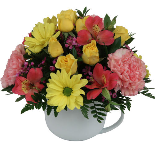 coffee mug flower arrangement  -  Colourful, uplifting flower arrangement that's sure to bring a smile to their face. A re-usable coffee mug is arranged with daisies, rose buds, carnations, alstroemerias and waxflower in shades of pink and yellow.