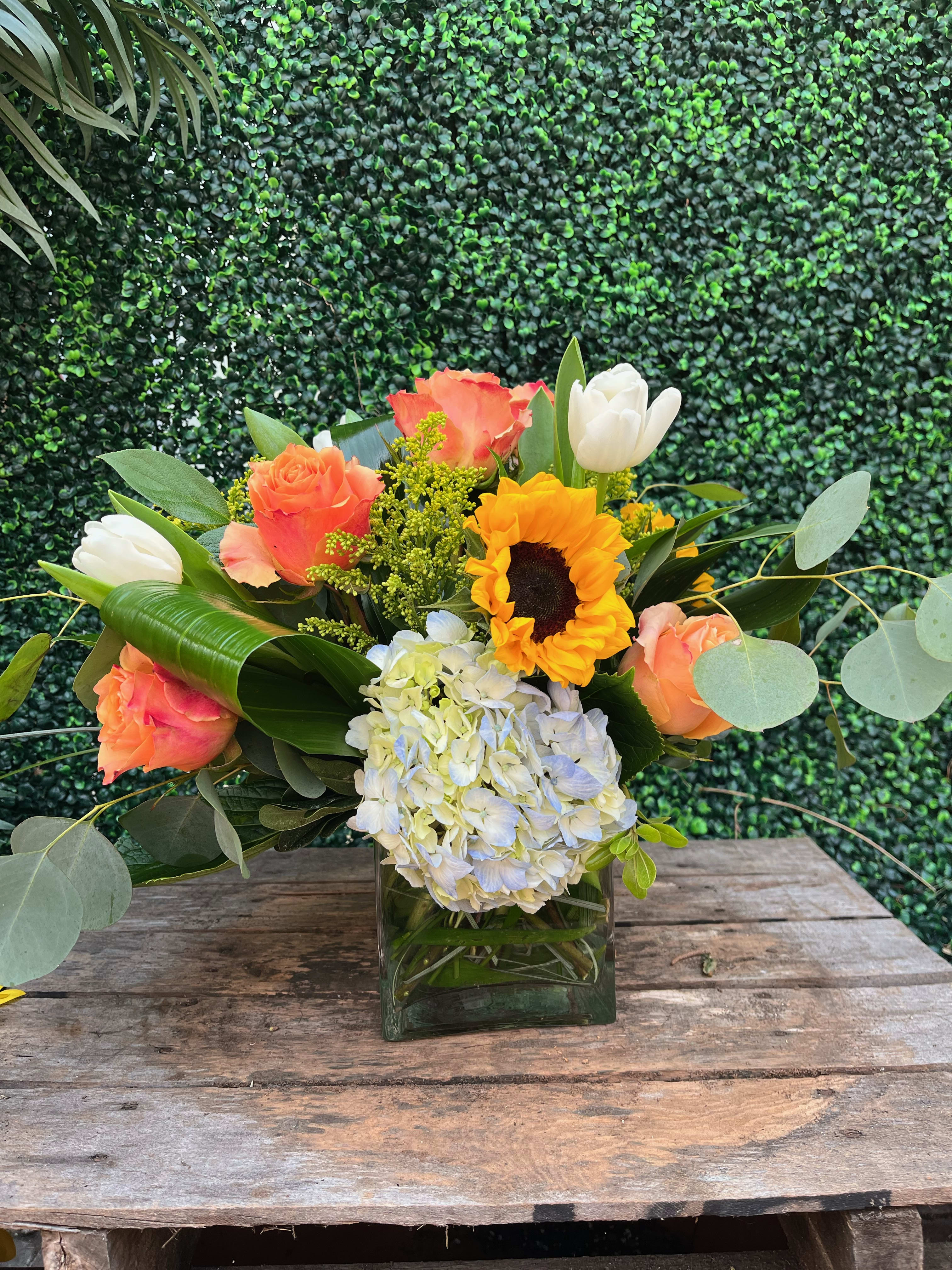 Summer Morning Summer Morning - Includes sunflowers, peach roses, whit tulips, etc. *Substitutions may be applied*