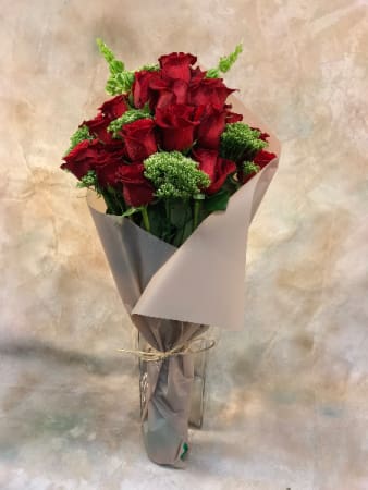 Paper Wrapped Roses - Fair Trade roses, hand-tied and elegantly wrapped in paper with dianthus or trachelium, myrtle, ruscus, for a downtown look. 