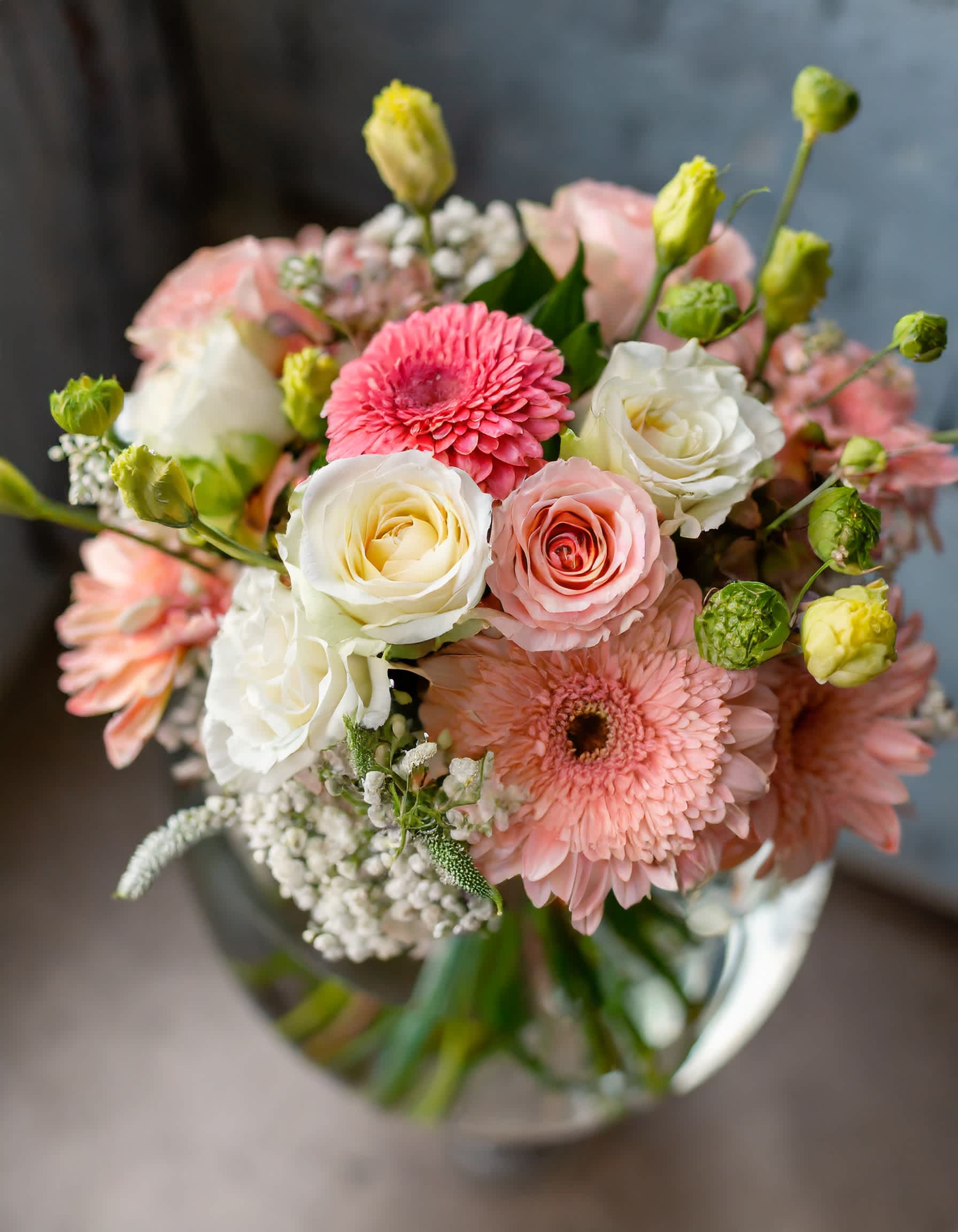Jezebel - A charming and beautiful bouquet in a clear vase, featuring a delightful mix of pink and white flowers. This lovely arrangement includes roses, dahlias, and an assortment of other blossoms, creating a delightful blend of colors and blooms.  Disclaimer: ALL IMAGES PROVIDED AT DELUXE PRICE Photos and visual presentation of the products represent an overall style, look and feel, which we may not be able to identically replicate in some instances  Recommended for: Love and Romance, I Love You Flowers, Anniversary, Proposal,  Romantic Gift, Birthday, Get Well Soon, Celebrations, Best Wishes, Thank You, Congratulations, Just Because, New Baby, Everyday, Sympathy