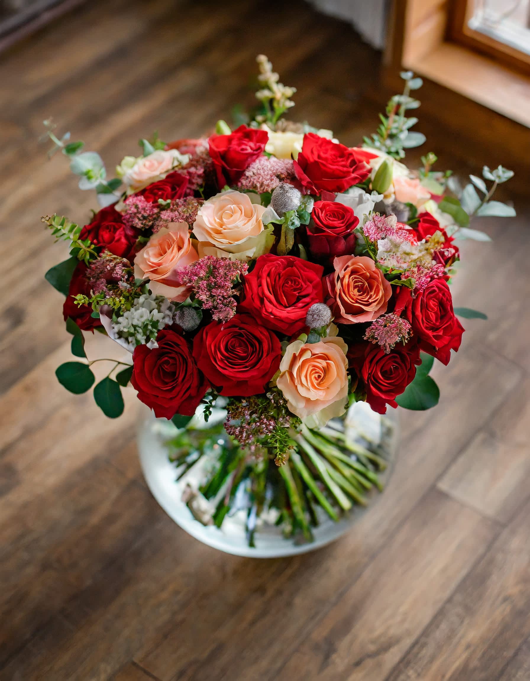 Your Sweet Smile Your Sweet Smile - A charming and beautiful bouquet featuring red roses and cream spray roses, elegantly arranged in a clear vase. The delightful aroma of eucalyptus adds a fragrant touch to this lovely arrangement. ALL IMAGES PROVIDED AT STANDART PRICE Photos and visual presentation of the products represent an overall style, look and feel, which we may not be able to identically replicate in some instances Recommended for: Love and Romance, I Love You Flowers, Anniversary, Proposal, Romantic Gift, Birthday, Get Well Soon, Celebrations, Best Wishes, Thank You, Congratulations, Just Because, New Baby, Everyday, Sympathy