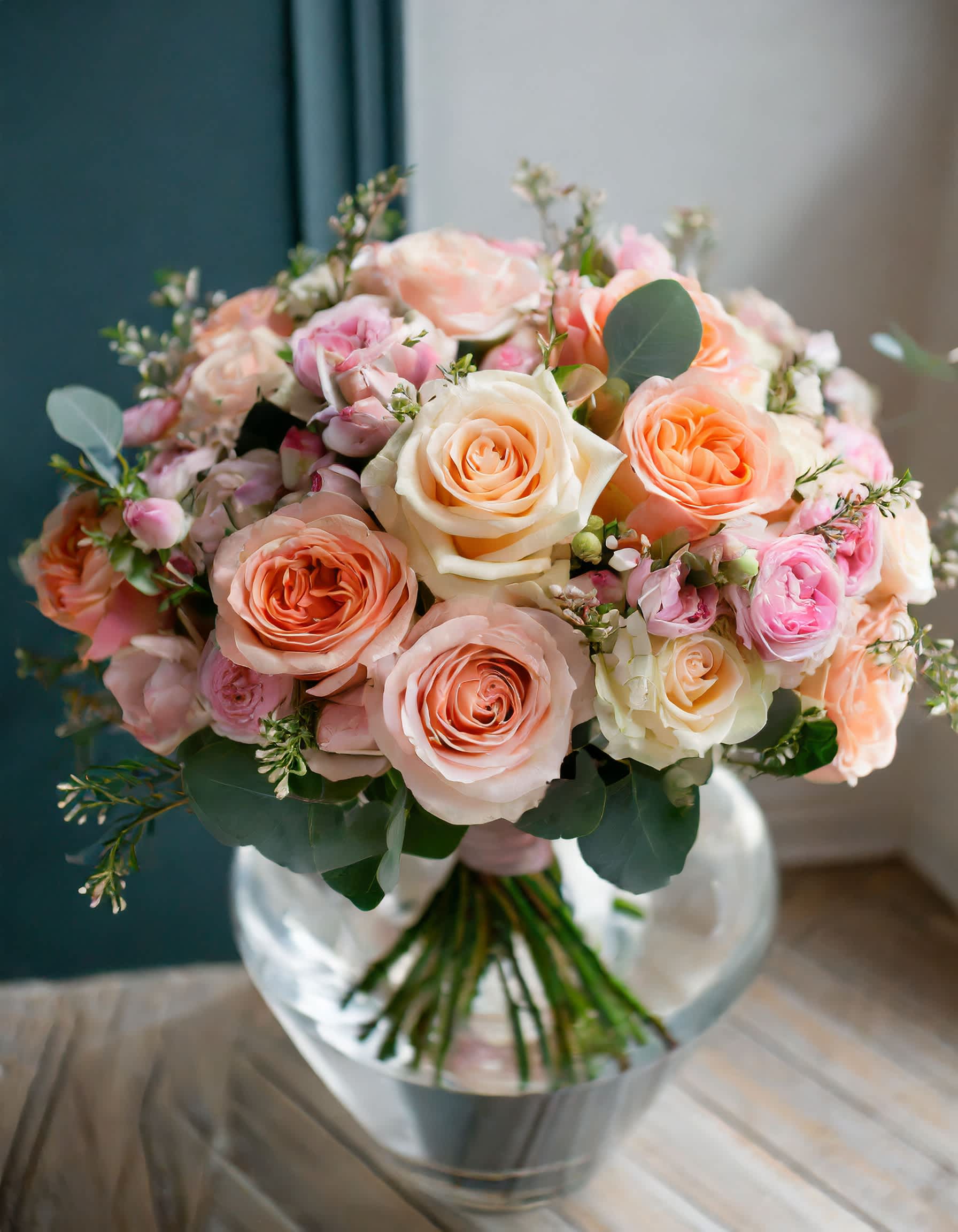 The Vanilla Cake - Delight in the exquisite charm of flowers entwined in a peach-hued ballet, forming a gentle symphony of warm tones. This botanical masterpiece radiates beauty with every petal  Disclaimer: ALL IMAGES PROVIDED AT DELUXE PRICE Photos and visual presentation of the products represent an overall style, look and feel, which we may not be able to identically replicate in some instances.