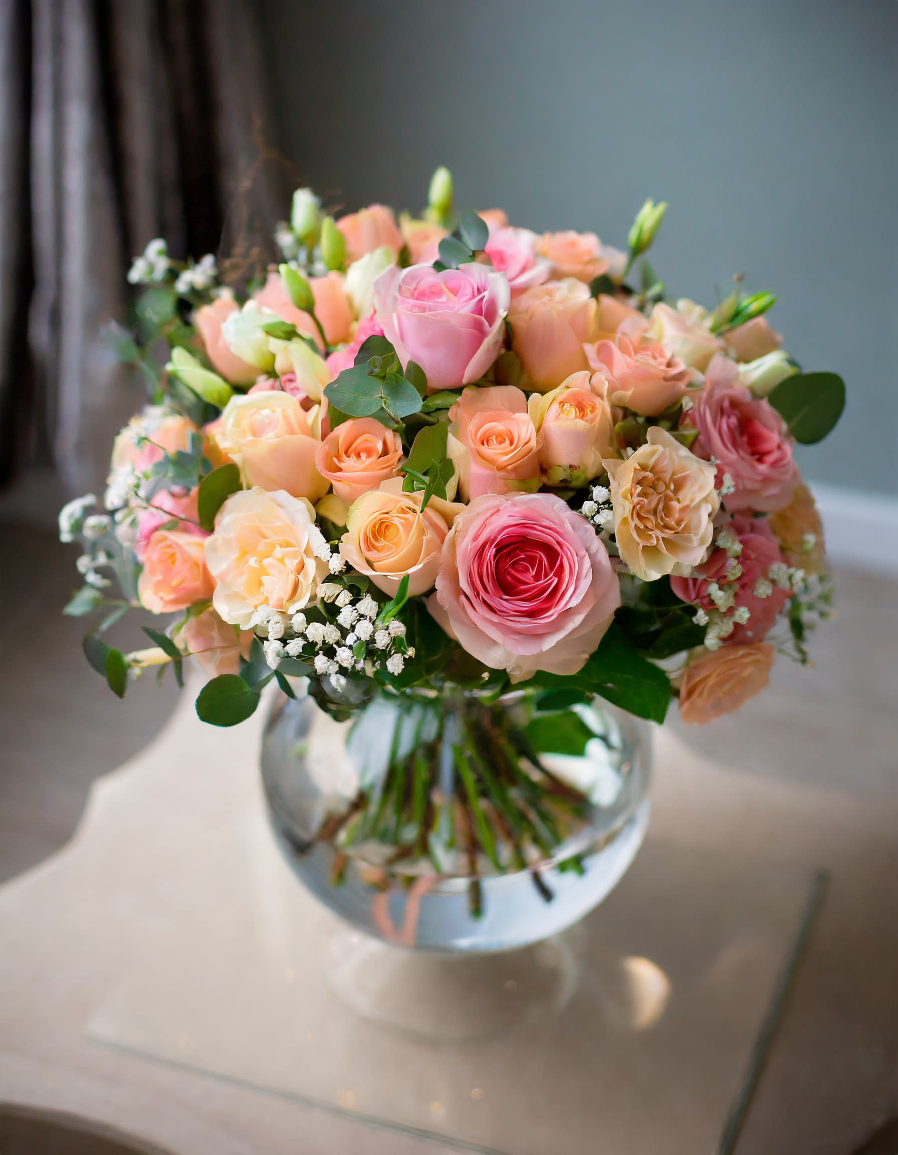 Victoria - A harmonious blend of flowers in a peach palette, creating a gentle composition that whispers warmth and elegance. Each bloom contributes to a symphony of soft hues, painting nature's canvas in delicate beauty.  Disclaimer: ALL IMAGES PROVIDED AT DELUXE PRICE Photos and visual presentation of the products represent an overall style, look and feel, which we may not be able to identically replicate in some instances.