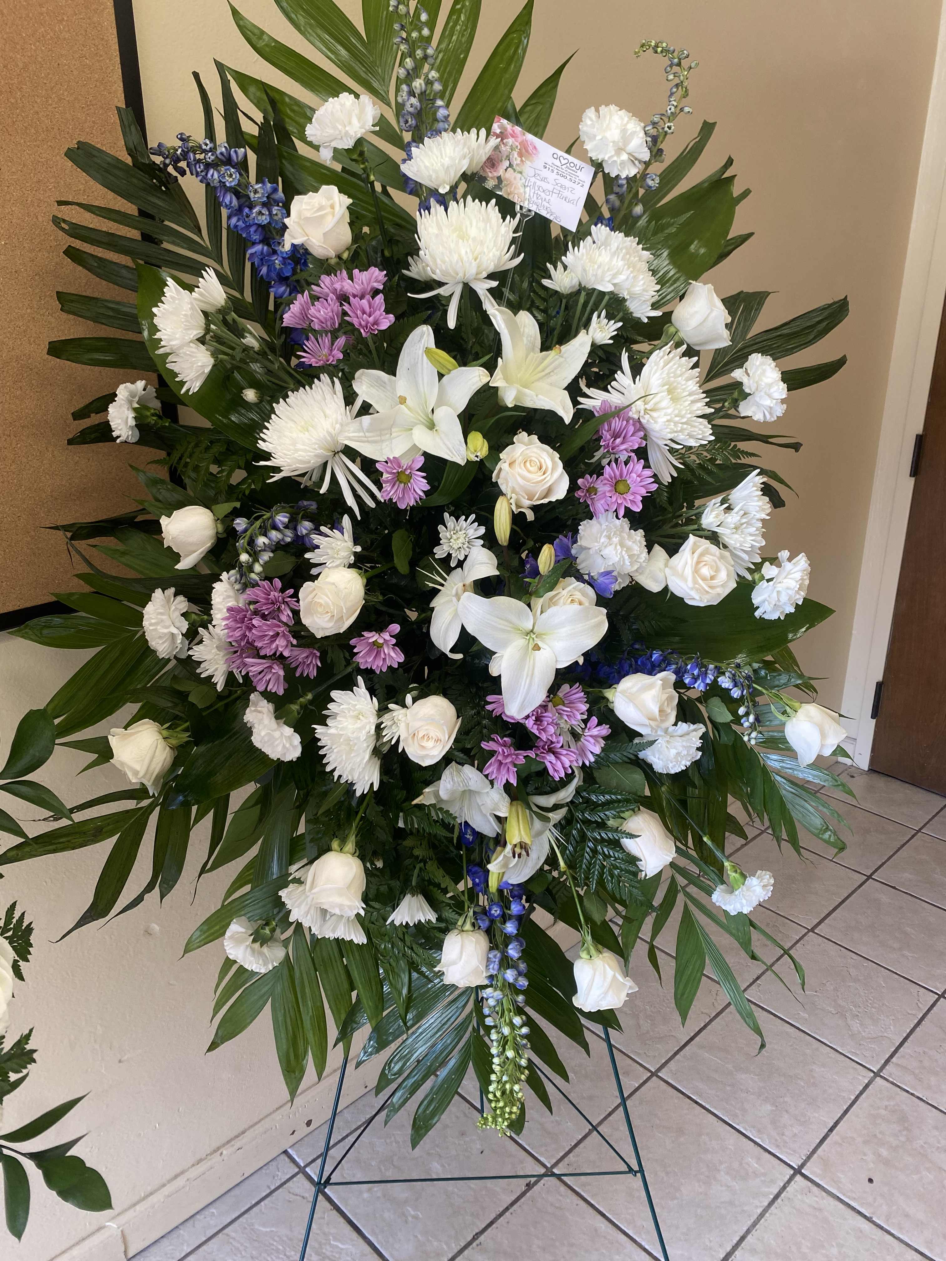 White and Lavender Standing Spray - A beautiful standing spray arrangement with white and lavender florals. Image shown is for premium arrangement