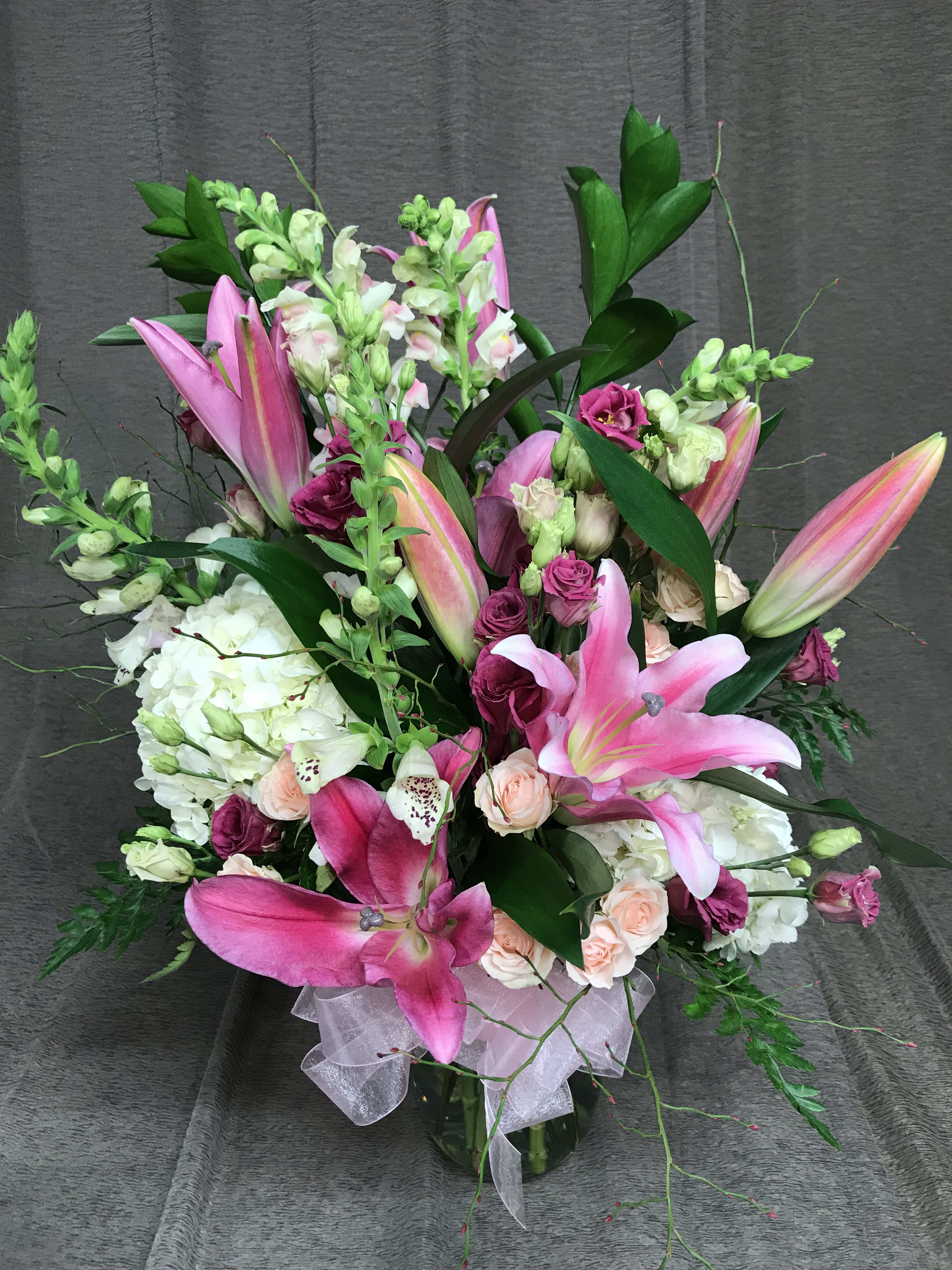 Oriental Lilies in Pink - Fragrant luscious lilies in combination with pretty feminine flowers suitable for a special anniversary or Valentine's day. Cousin to the Stargazer lily. Selection will vary by season.   Premium imported flowers from around the world make this a stunning and interesting design.