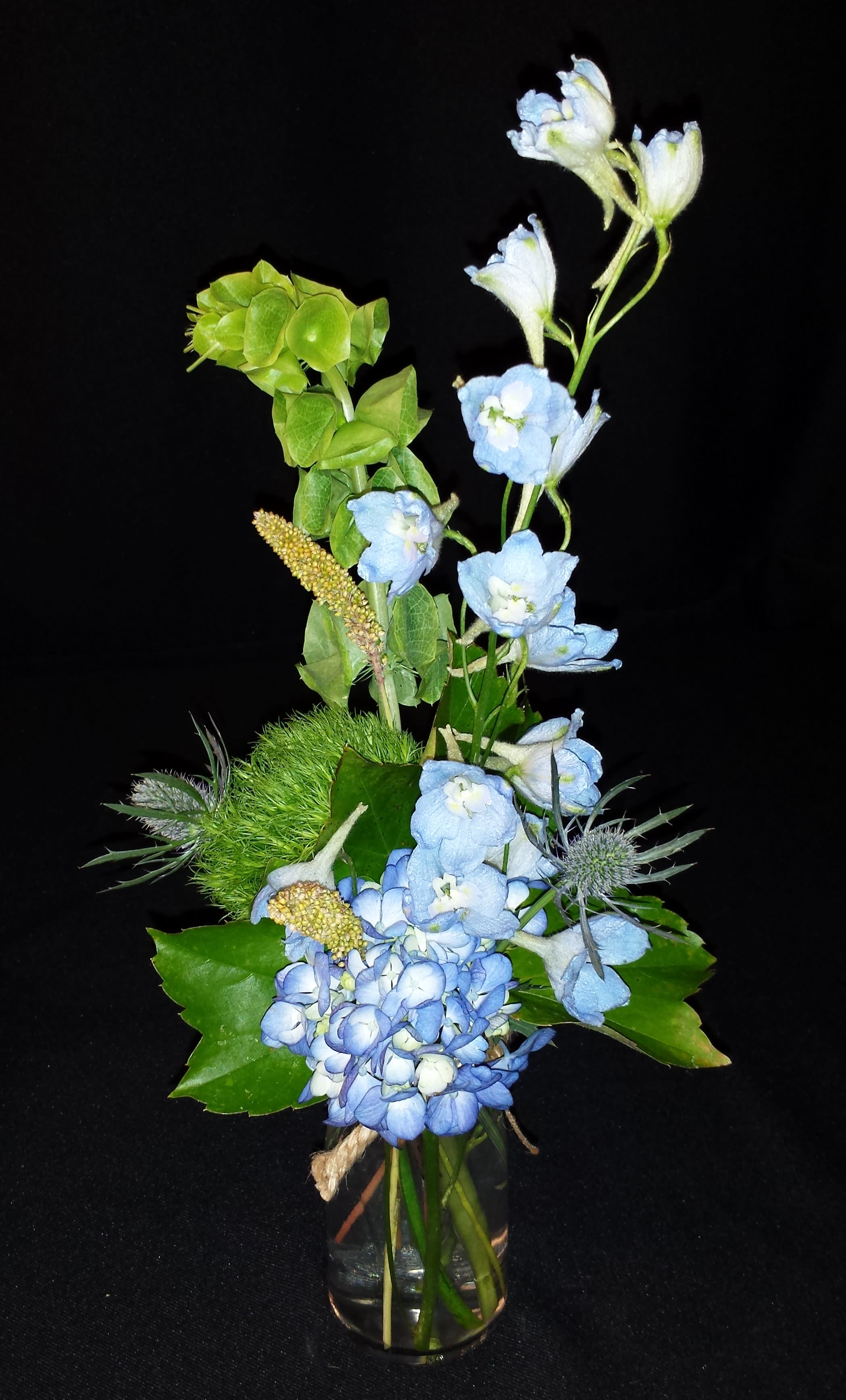Vintage bud vase Vintage bud vase - Vintage style flowers and small vase holds just a small handful of stems. Colors and items will vary. This is our smallest arrangement of flowers. Sweet on a nightstand or in a small cubicle office space or dorm.