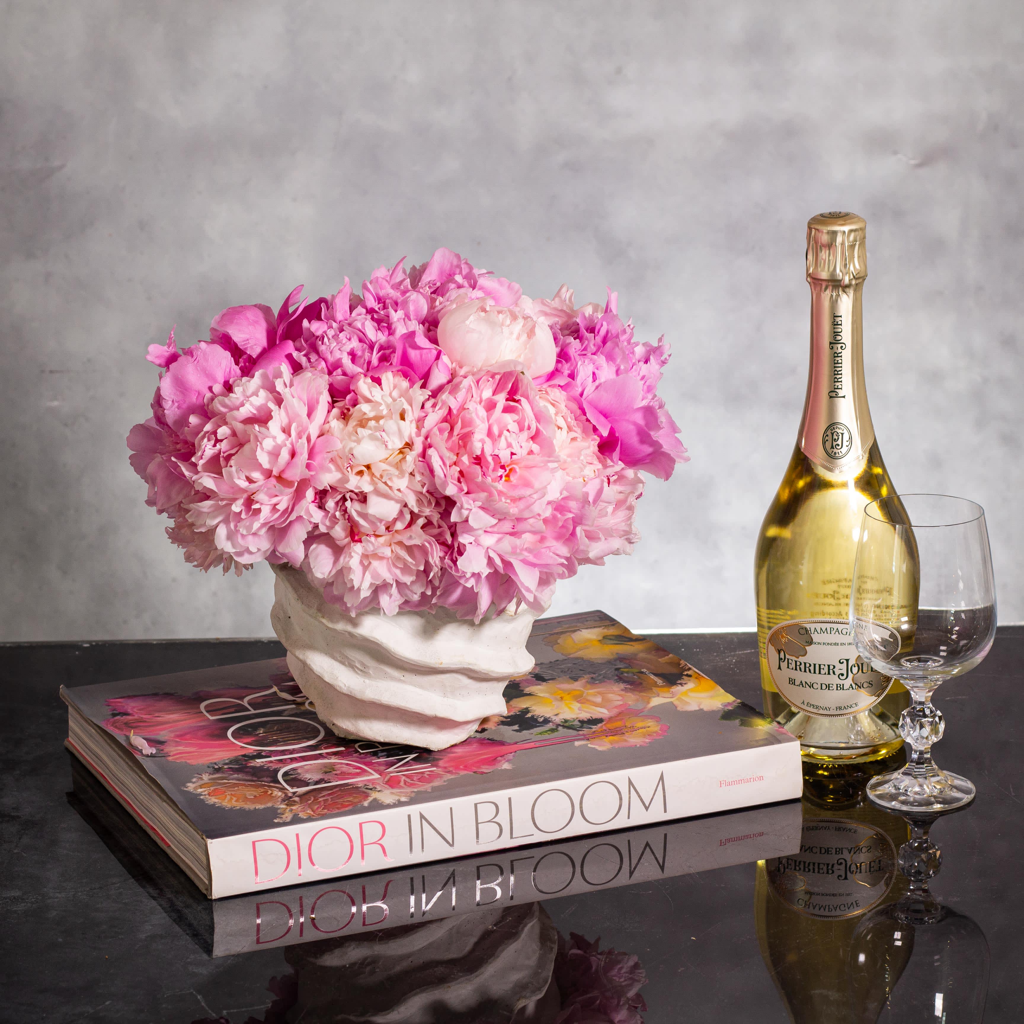 Pink Peony Paradise - Pasadena Florist - Order for same day delivery - Pink Peony Paradise is a stunning floral arrangement featuring 25 beautiful pink peonies elegantly displayed in a stylish white modern vessel. This luxurious arrangement, about 10&quot; round, is perfect for same day delivery in Beverly Hills and nearby cities. The lush pink peonies exude elegance and charm, creating a graceful centerpiece that will surely delight anyone who receives it.