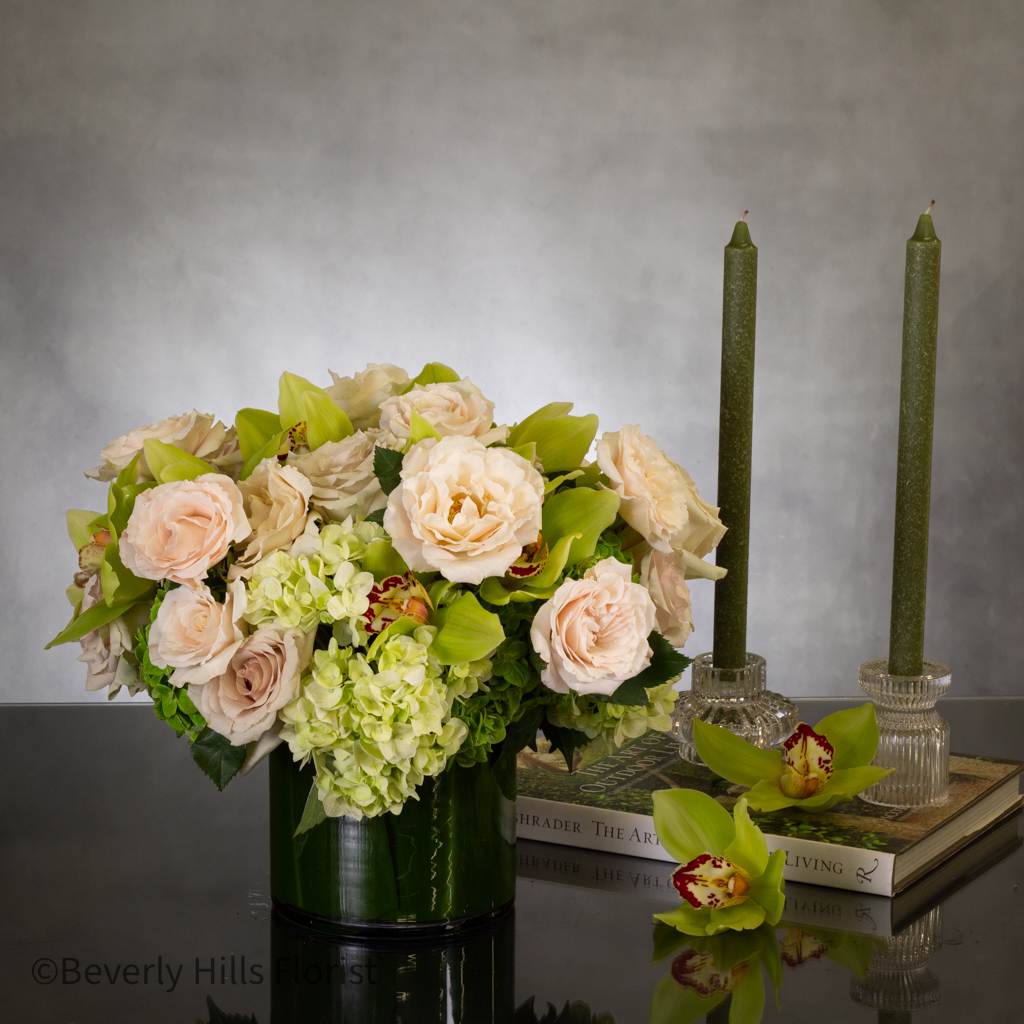 Champagne Roses and Greens - Pasadena Florist  - 24 Champagne roses accompanied by Green cymbidium orchids and verdant floral arrangements in an exquisite glass vase adorned with leaf patterns. Exuding a sense of romance, grace, and affection, this bouquet is perfect for celebrating birthdays or sending well wishes.  10&quot; round 