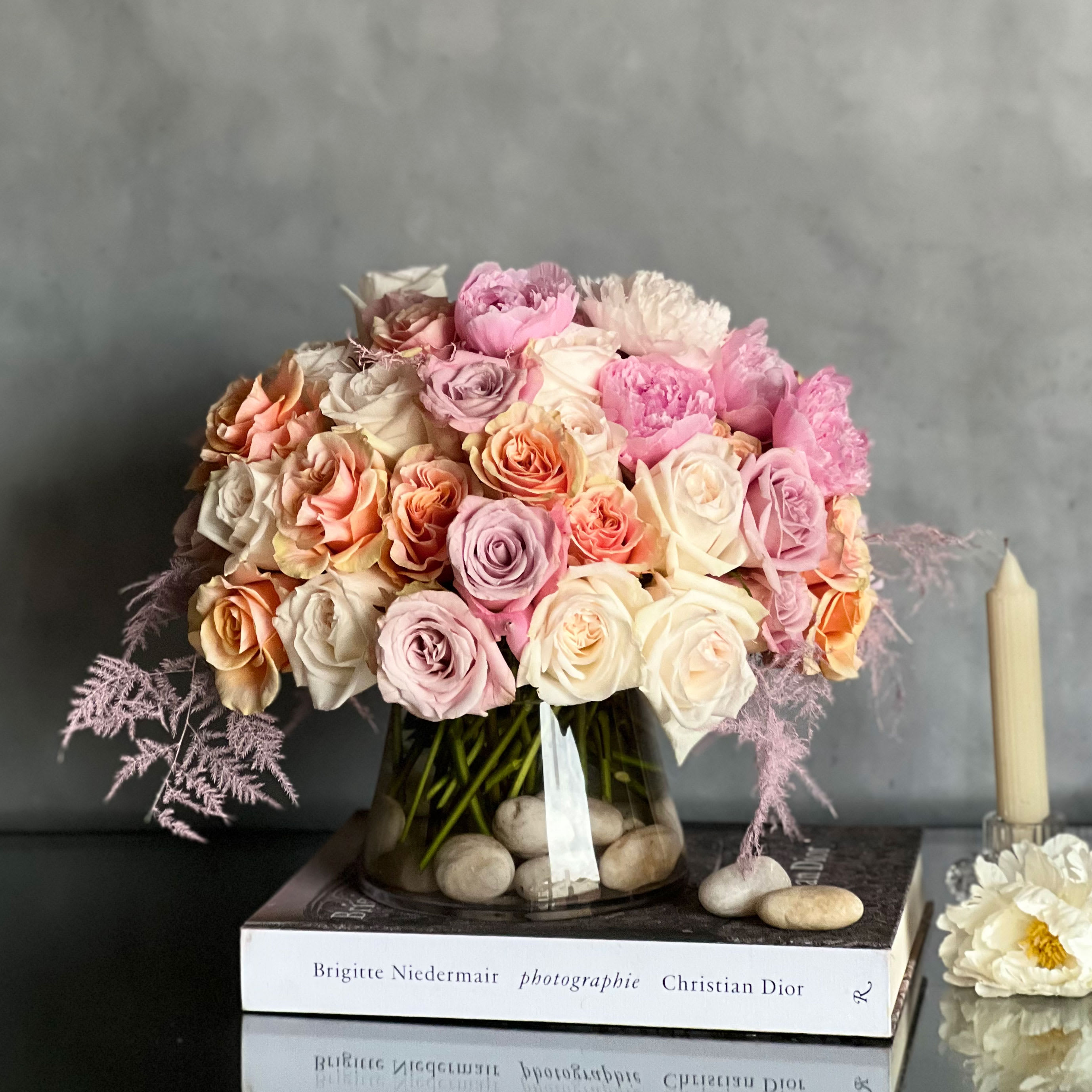 Pink &amp; Chic - Pasadena Florist  - &quot;Pink &amp; Chic&quot; consists of a beautiful array of various pink Roses &amp; multicolored Peonies. All arranged within a clear glass vase that is accented with nude stones. perfect for any occasion and event. 