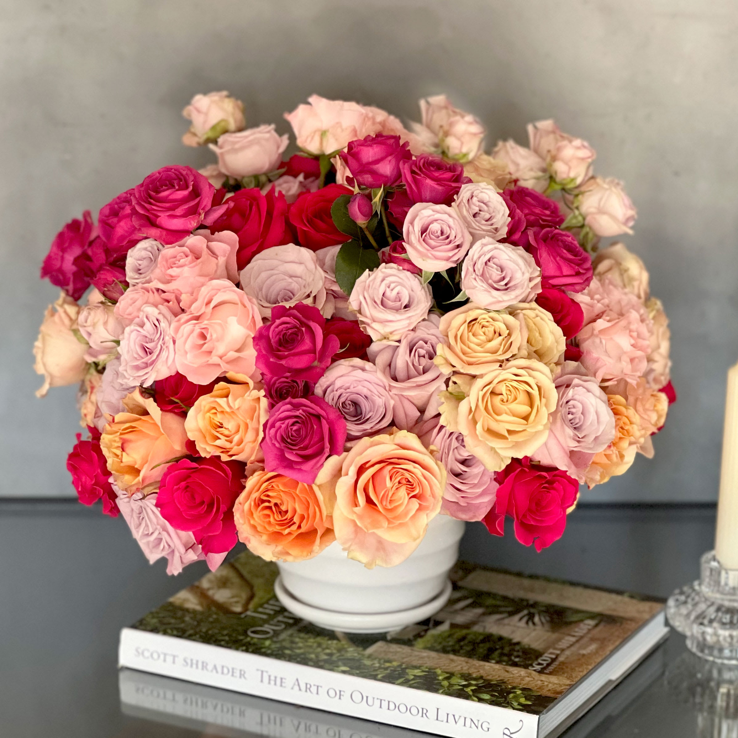 Rose Rendezvous - Pasadena Florist - An exquisite and vibrant display of over 50 blooms of different varieties of colorful roses. Fabulous for any décor or occasion.  Overal: 17.5x15 Deluxe: over 75 Roses  Premium over 100 Roses   