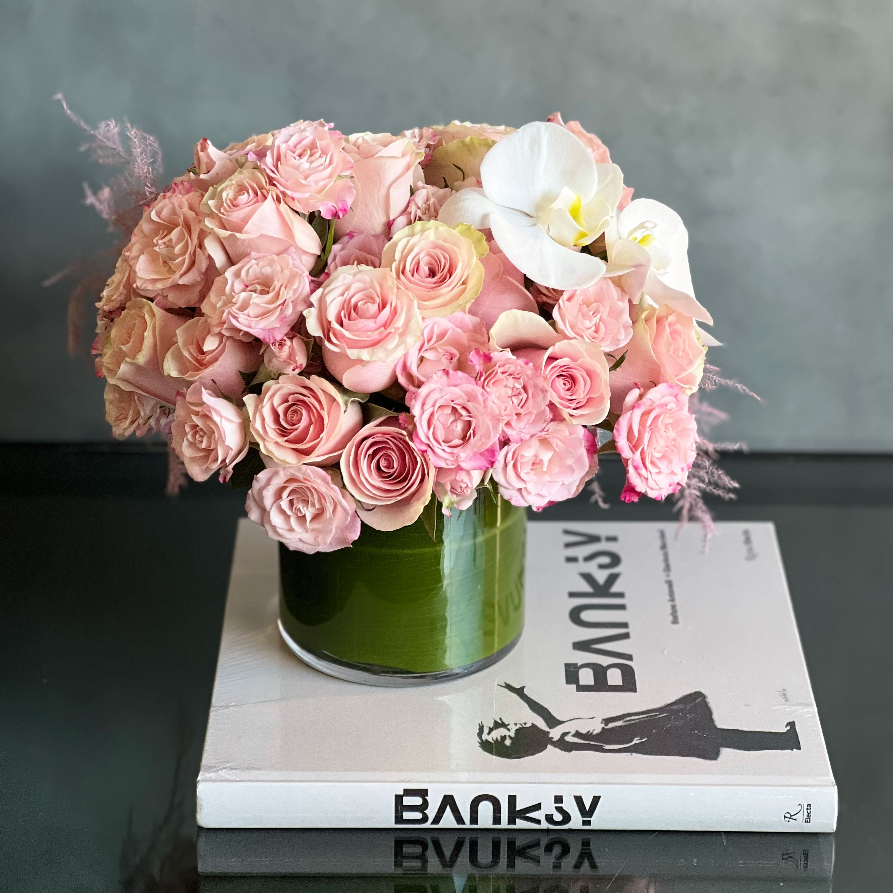 A Little Pink Me Up! - Pasadena Florist - Pinks are popping in this delicate and delightful 24 pink roses, pink spray roses with 2 pink cymbidium orchids . A beautiful floral gift that will make a lasting impression.  